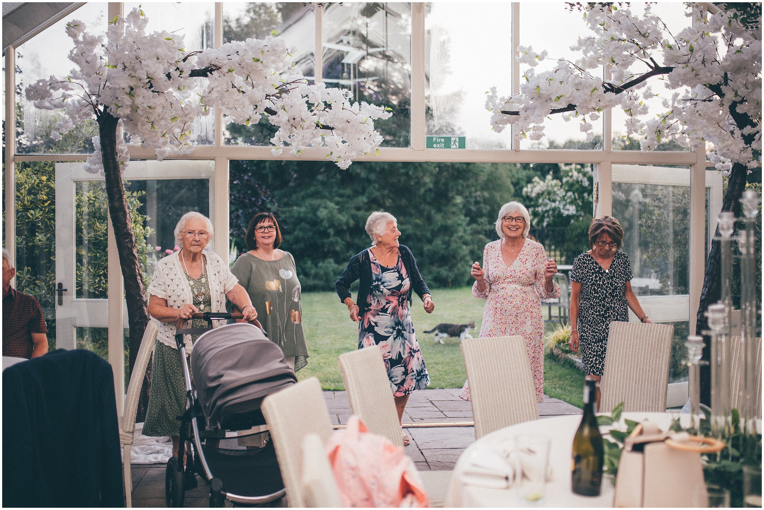 Wedding Guests enjoy the dancefloor at Abbeywood Estate wedding venue in Delamere, Cheshire.
