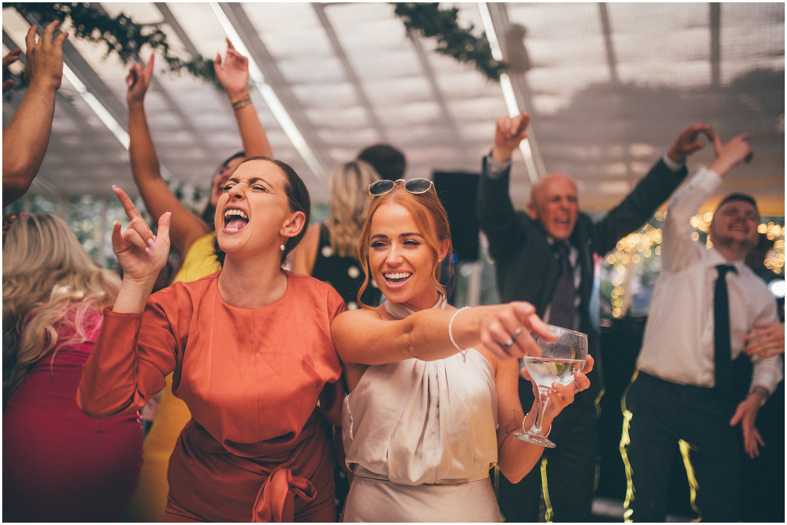 Guests enjoy the dancefloor at Abbeywood Estate wedding venue in Delamere, Cheshire.