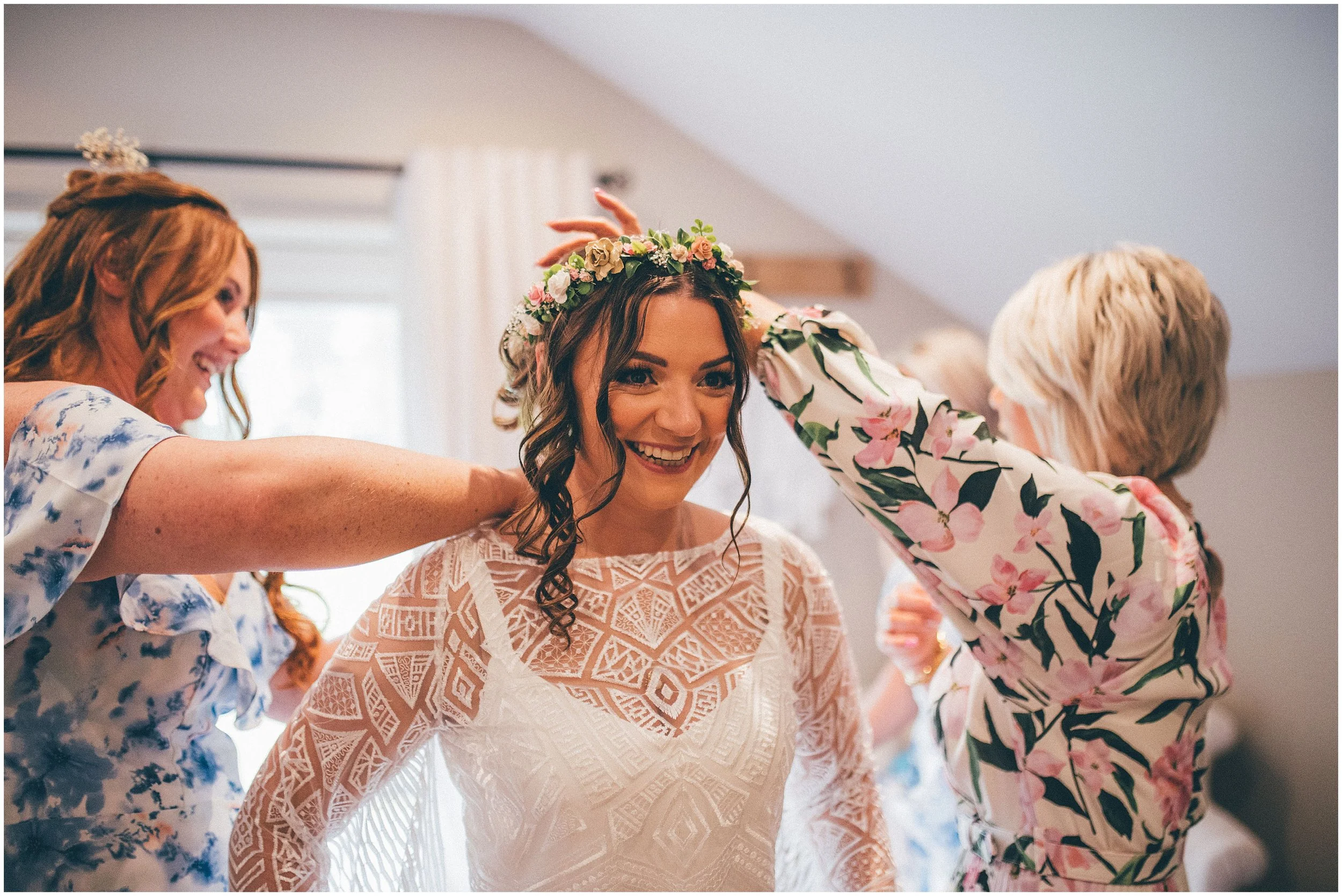 Bride's helped into her Lucy Can't Dance Pulp Fiction dress at Hobbit Hill wedding venue