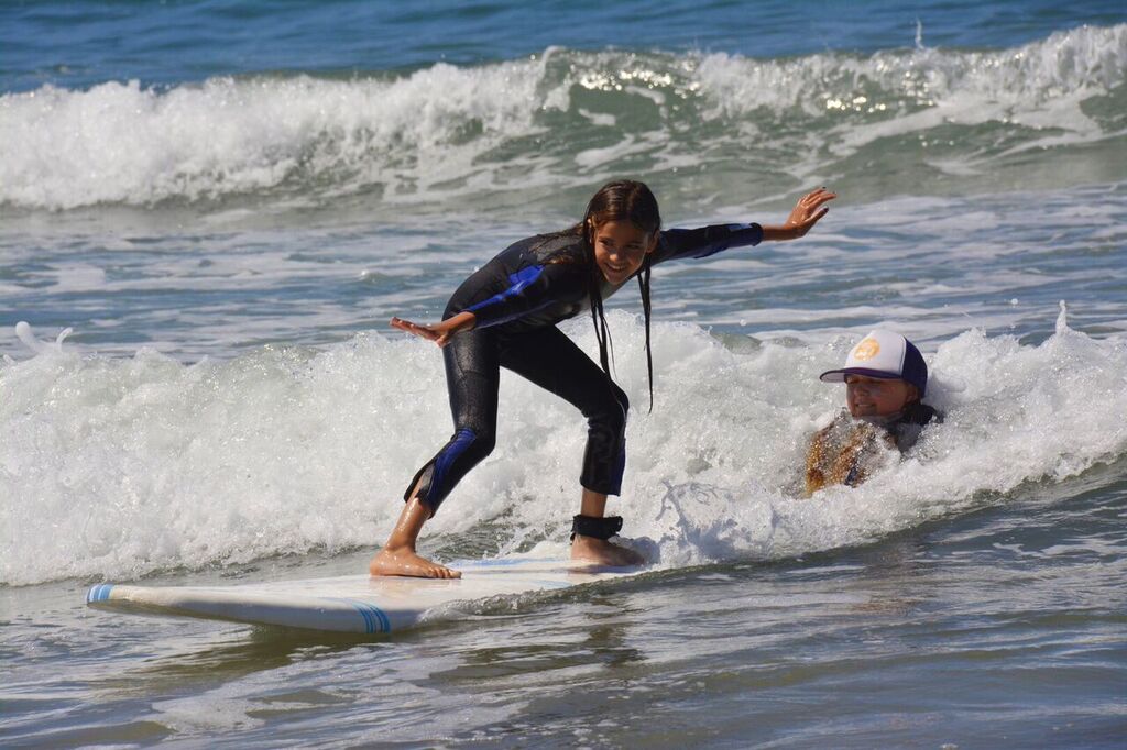 young girl surfing