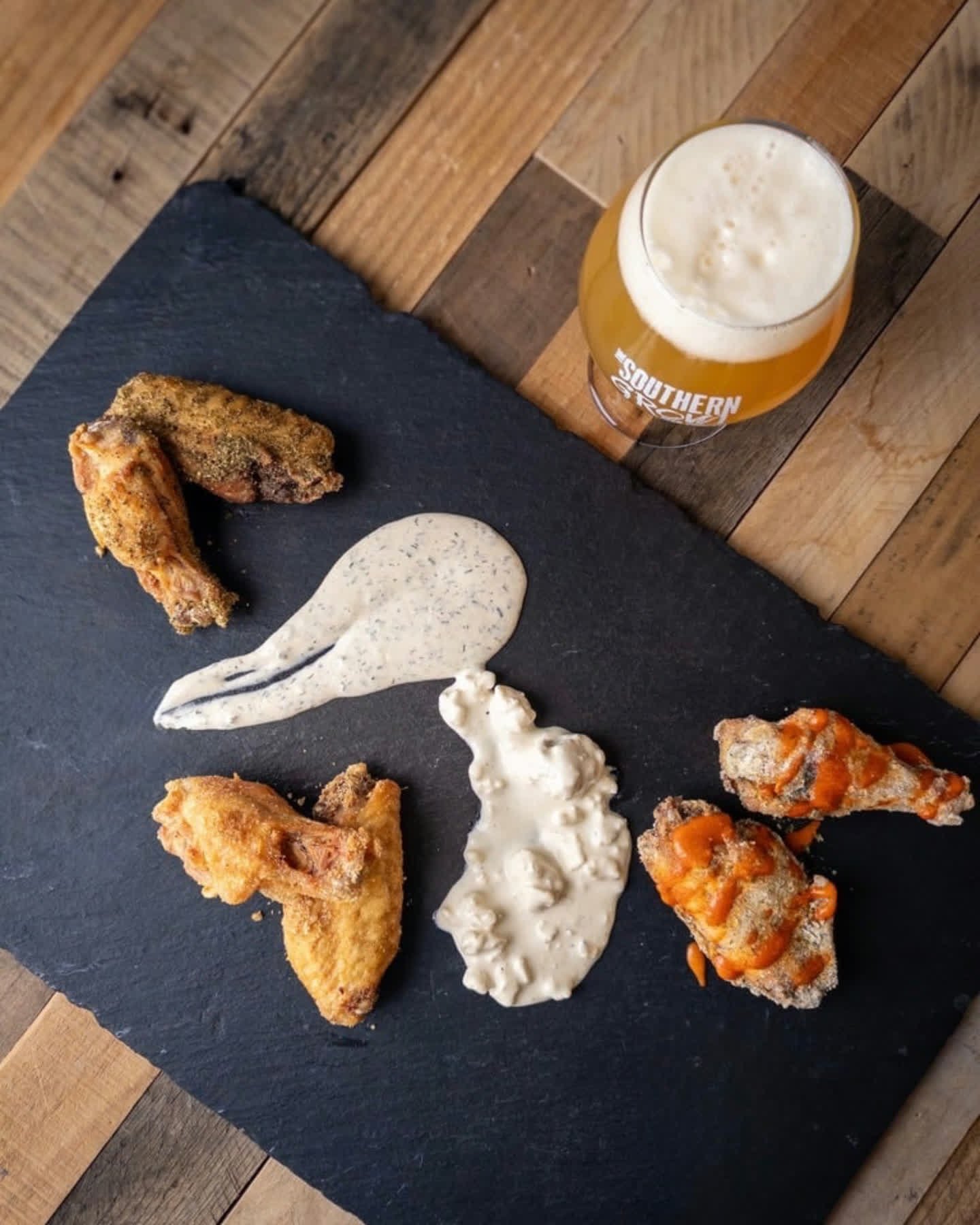 WINGS
6 chicken wings with your choice of wing flavor and house ranch or blue cheese dressing.
- SRIRACHA BUFFALO: tossed in ranch dry rub with sriracha buffalo sauce on the side
- FENNEL GARLIC DRY RUB
- THAI LEMON PEOPER DRY RUB 

Wings available d
