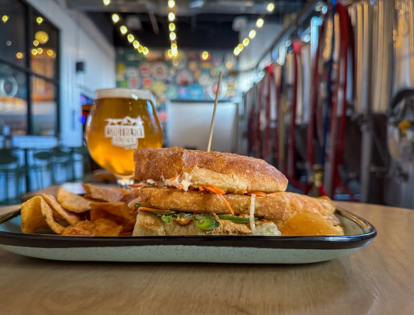 TOFU BANH MI
fried tofu, pickled carrots and radish, fresh jalape&ntilde;o, vegan mayo, and walnut p&acirc;t&eacute; on house stirato. 
Pair with PURR PILS, German Style Pilsner available on draft and in 16oz cans to-go. 

Tofu Banh Mi available duri