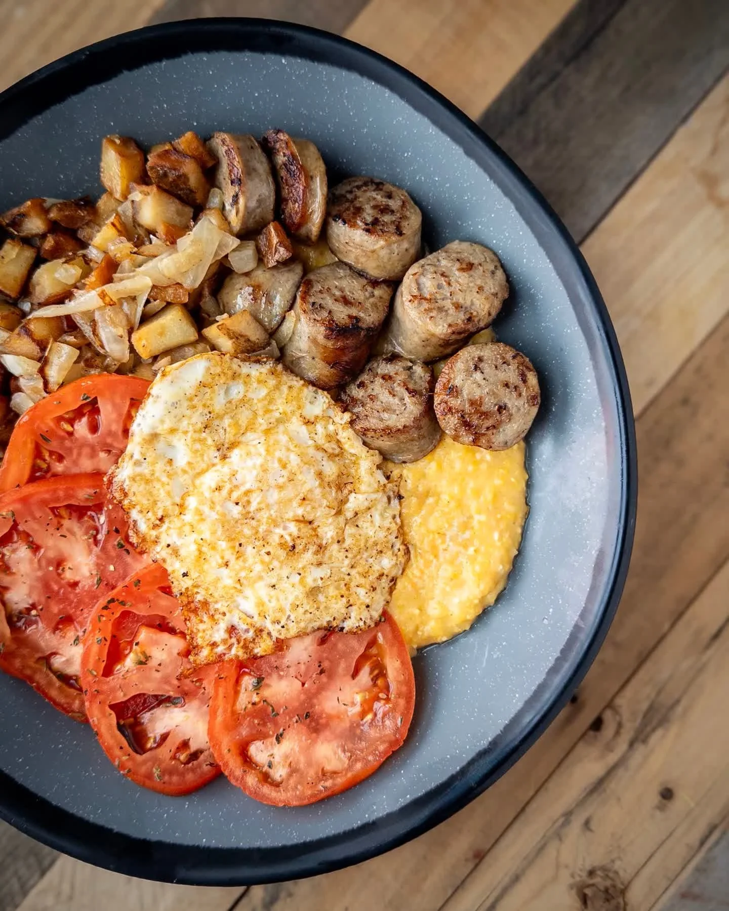BRATWURST &amp; GRITS 
creamy stone ground grits topped with beer-braised bratwurst, marinated tomato, potato &amp; onion mix, and an over easy egg. 

Bratwurst &amp; Grits available during Brunch every Saturday and Sunday from 10am - 2pm. Full food 
