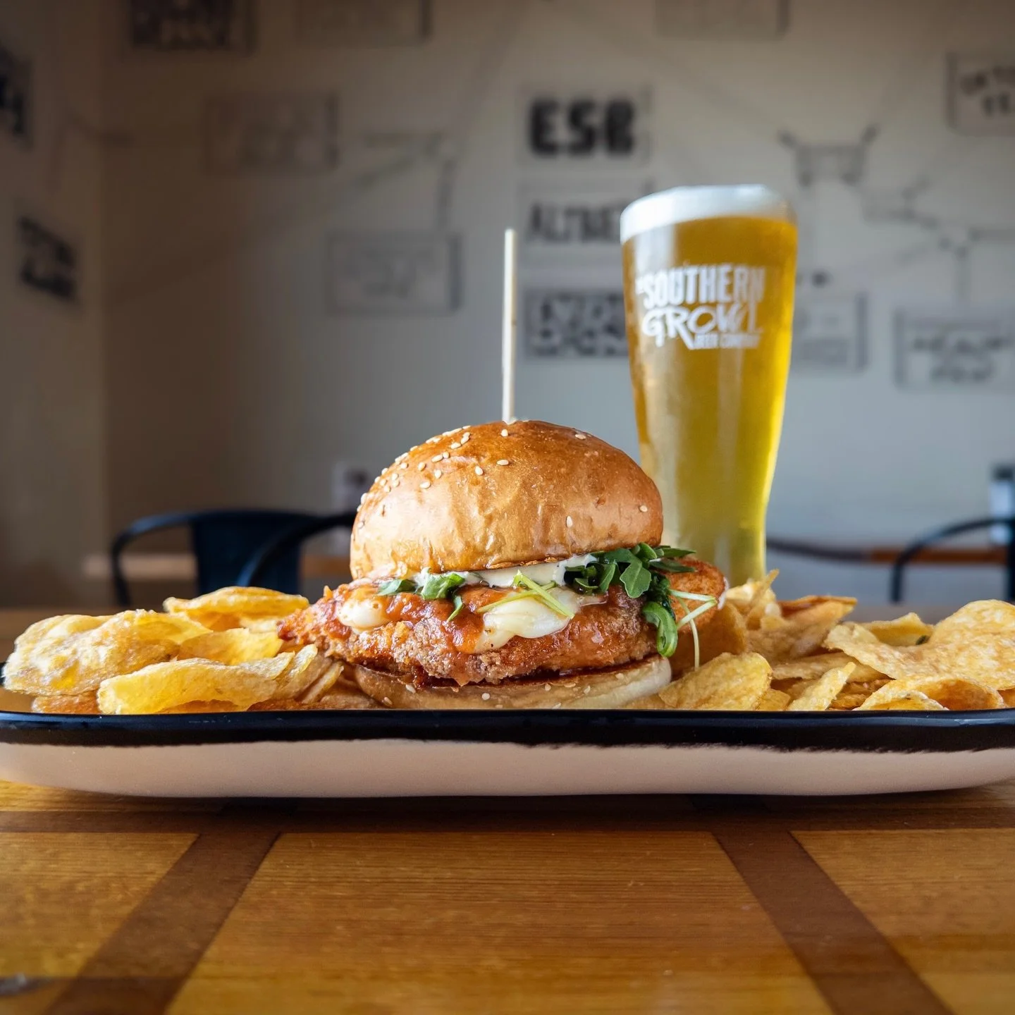 Weekly Sandwich Special: 
FIVE ALARM CHICKEN PARM SANDWICH
fried Parmesan chicken breast topped with spicy marinara, sliced mozzarella, arugula, and Caesar dressing on a house bun. 
Pair with LEANING TOWER OF PILSNA, Italian-style Pilsner available o