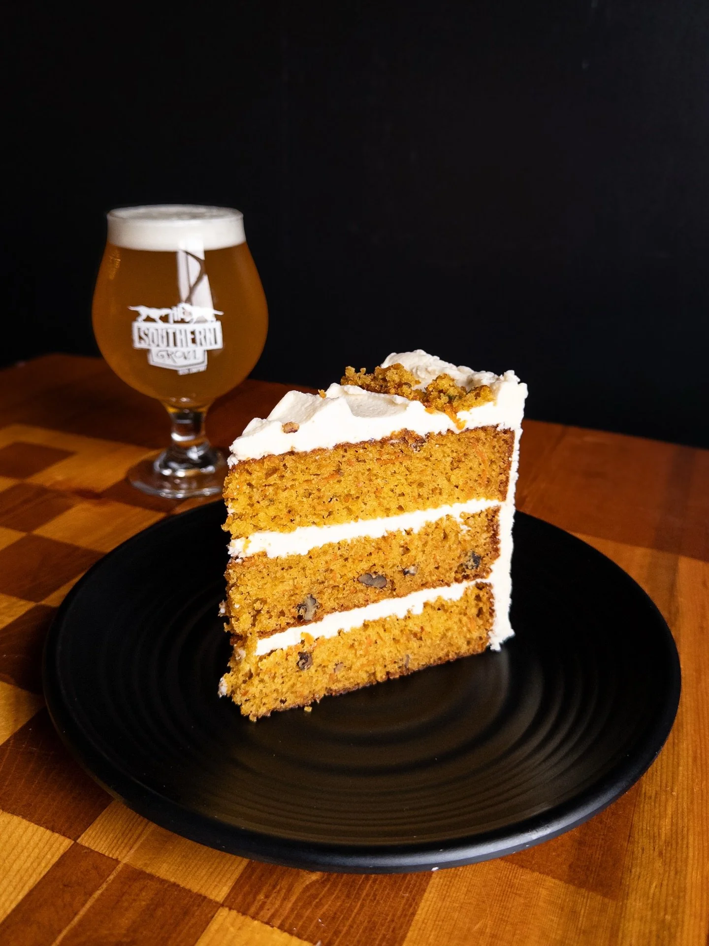 CARROT CAKE
with browned butter cream cheese frosting. 
Pair with WOLF PACK, Double IPA available on draft and in 16oz cans to-go. 

Carrot Cake available during dinner through March. Full food and drink menus available on our website, link in bio.