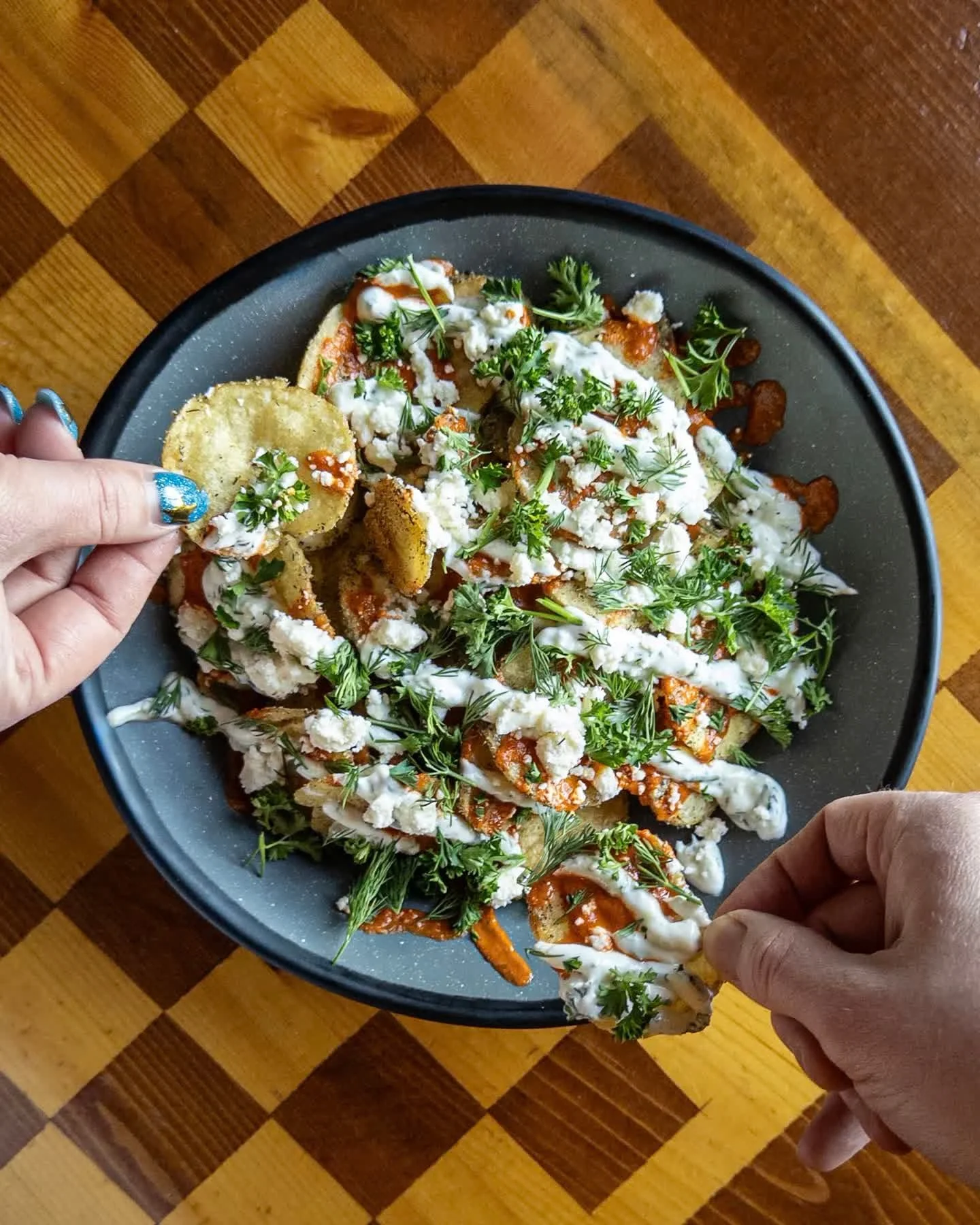LOADED GREEK CHIPS
house potato chips topped with lemon garlic butter and Greek seasoning, feta, tzatziki, roasted red pepper hot sauce, and fresh herbs. 
Pair with EARL OF THE ABBEY, Belgian Tripel available on tap and in 16oz cans to-go. 

Loaded G