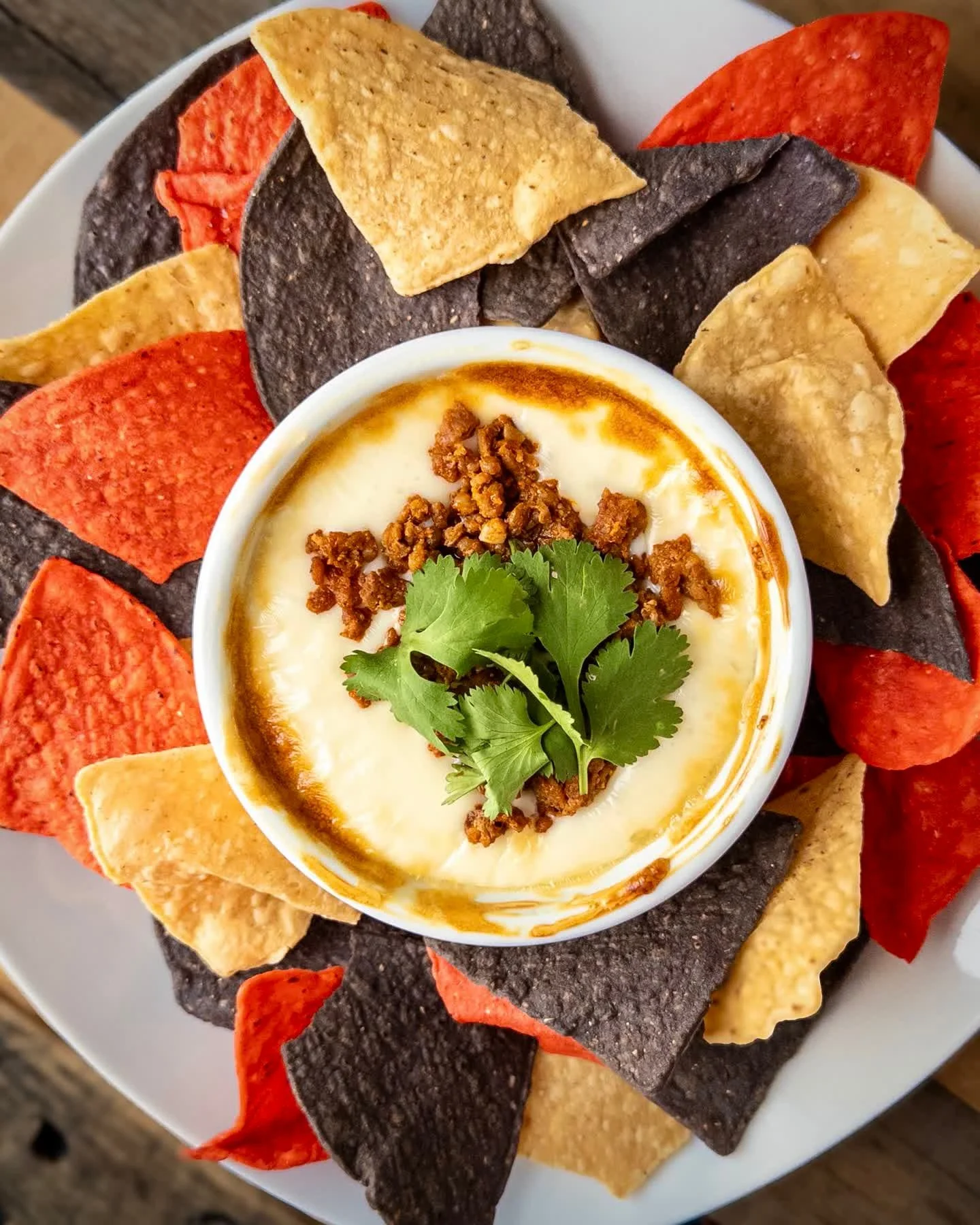 CHORI-QUESO DIP
white queso with chorizo topped with cilantro and served with tricolor corn chips. 
Pair with CHILLSNER, Pilsner with lime available on draft and in 16oz cans to-go. 

Chori-Queso Dip available now during dinner. Full food and drink m