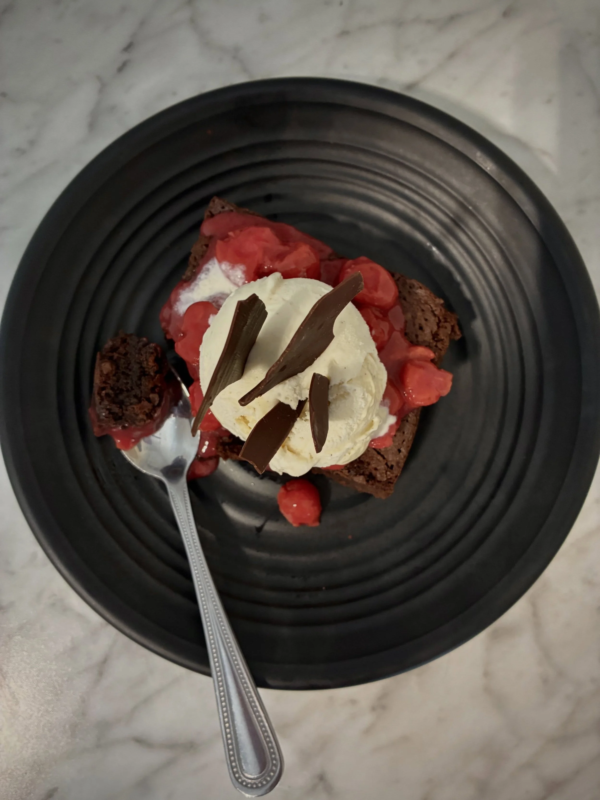 BLACK FOREST BROWNIE SUNDAE
Warm brownie topped with vanilla ice cream, cherry Kirsch and chocolate shavings.
Pair with 12th Anniversary Imperial Stout, available on draft now. 

BLACK FOREST BROWNIE SUNDAE available now during dinner through Septemb