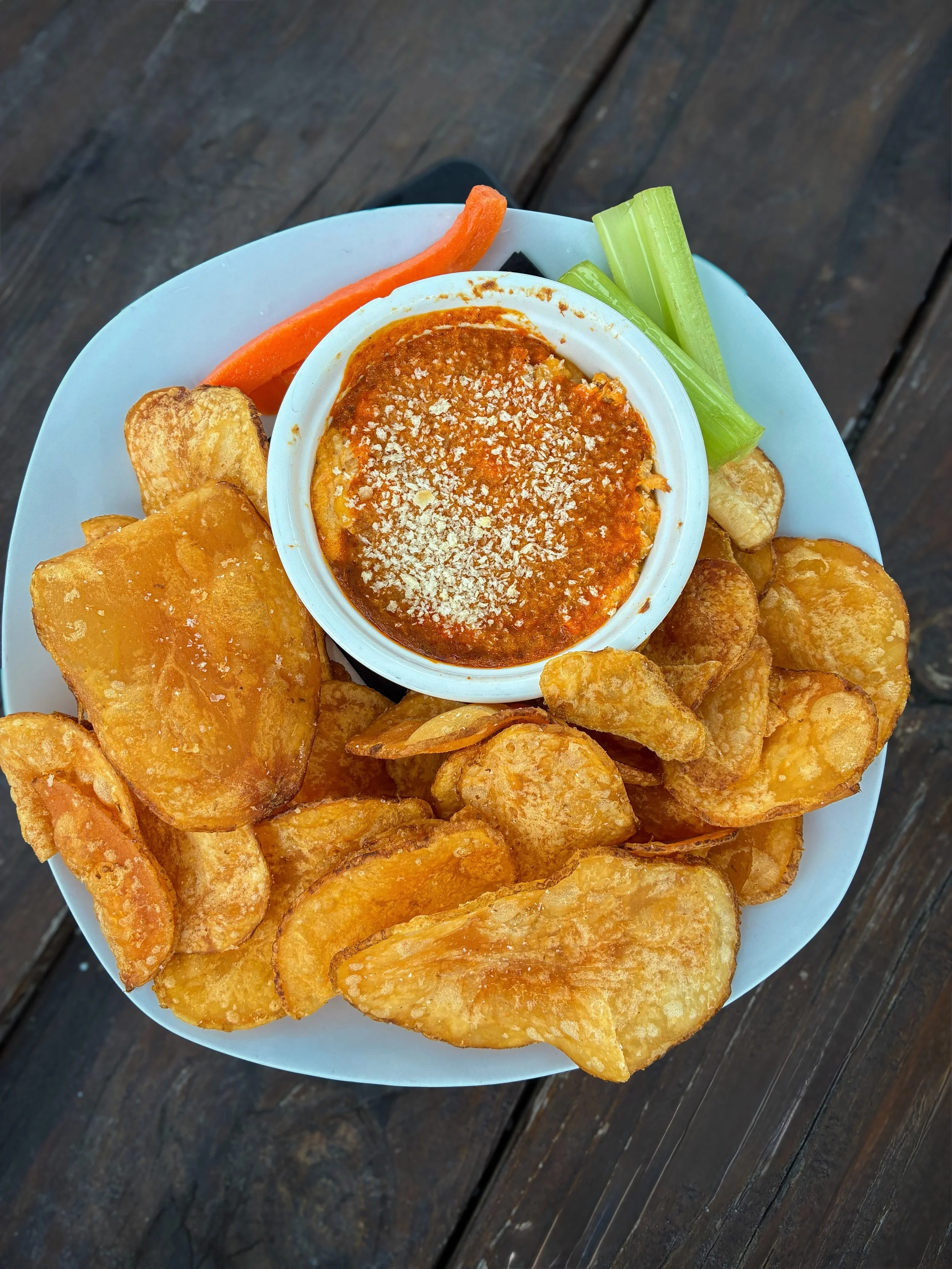 BUFFALO CHICKEN DIP
House made creamy buffalo chicken dip served warm with house potato chips. 
Available during dinner. 
Pair with WHEATNESS PROTECTION PROGRAM: American wheat ale with vista hops, 5.9% 
Available on draft now. 
Full food and drink m
