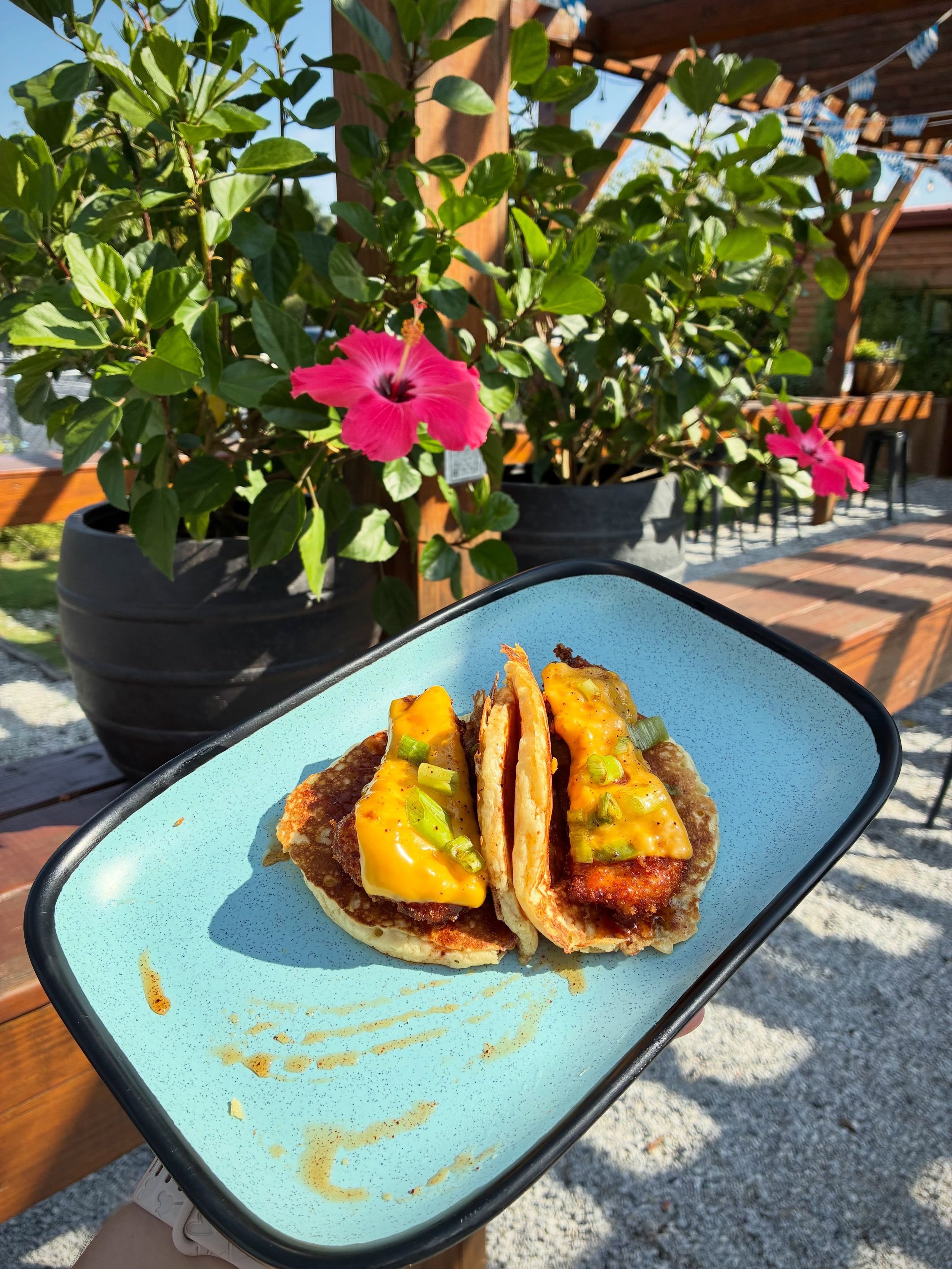 BREAKFAST BIRDDOG
two pancake &ldquo;tacos&rdquo; filled with fried chicken, American cheese, maple hot honey, and green onions with a side of chips.
Available during brunch Saturday and Sunday 10AM-2PM
Pair with BURY ME IN STRATA, southern IPA brewe