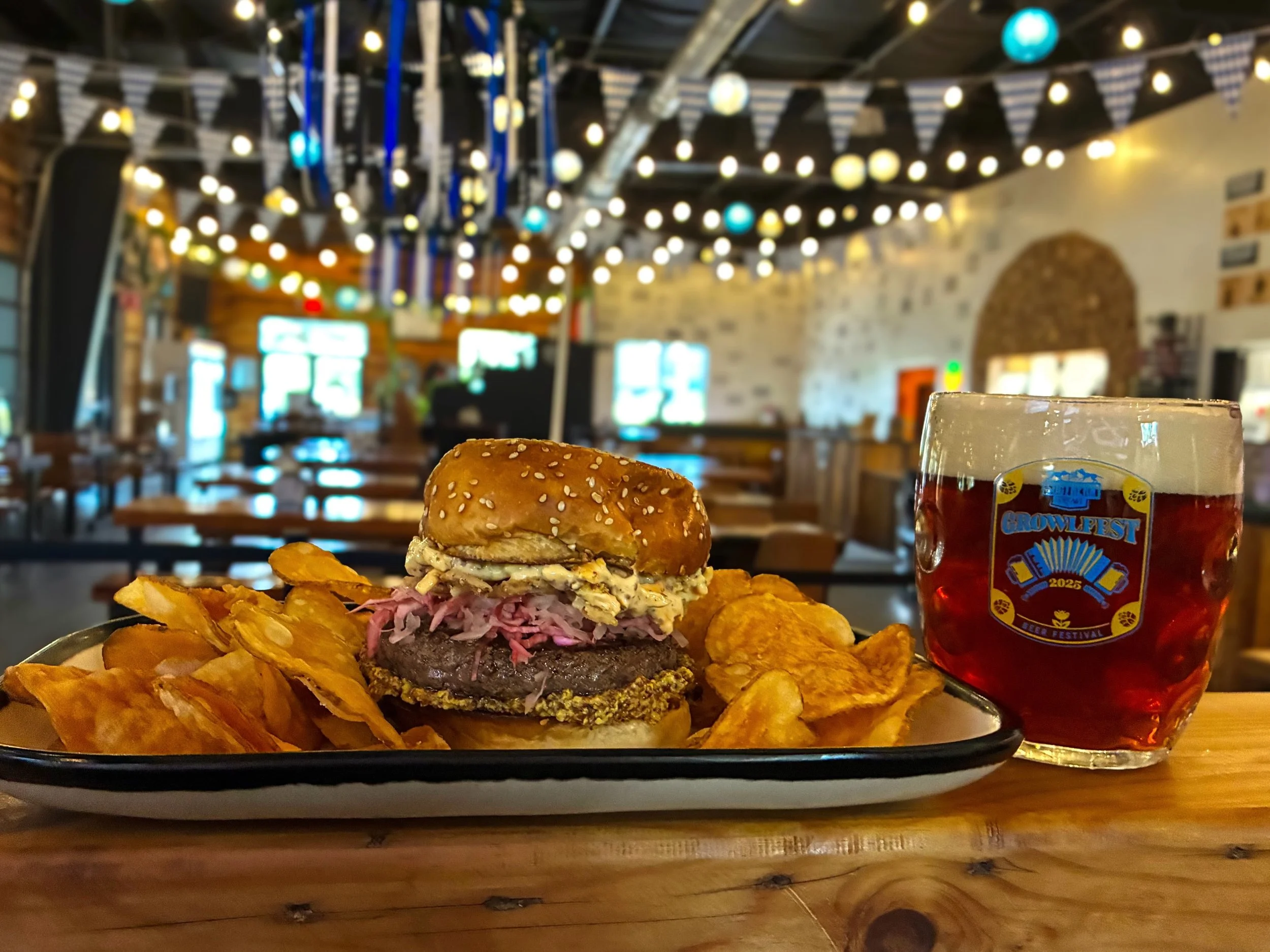 FESTBURGER topped with M&auml;rzen beer cheese spread, red cabbage sauerkraut, whole grain mustard, and crispy onions on a house sesame bun. 
Burger special available until Sunday during lunch, dinner, and brunch. 
Pair with M&Auml;RZEN German style 