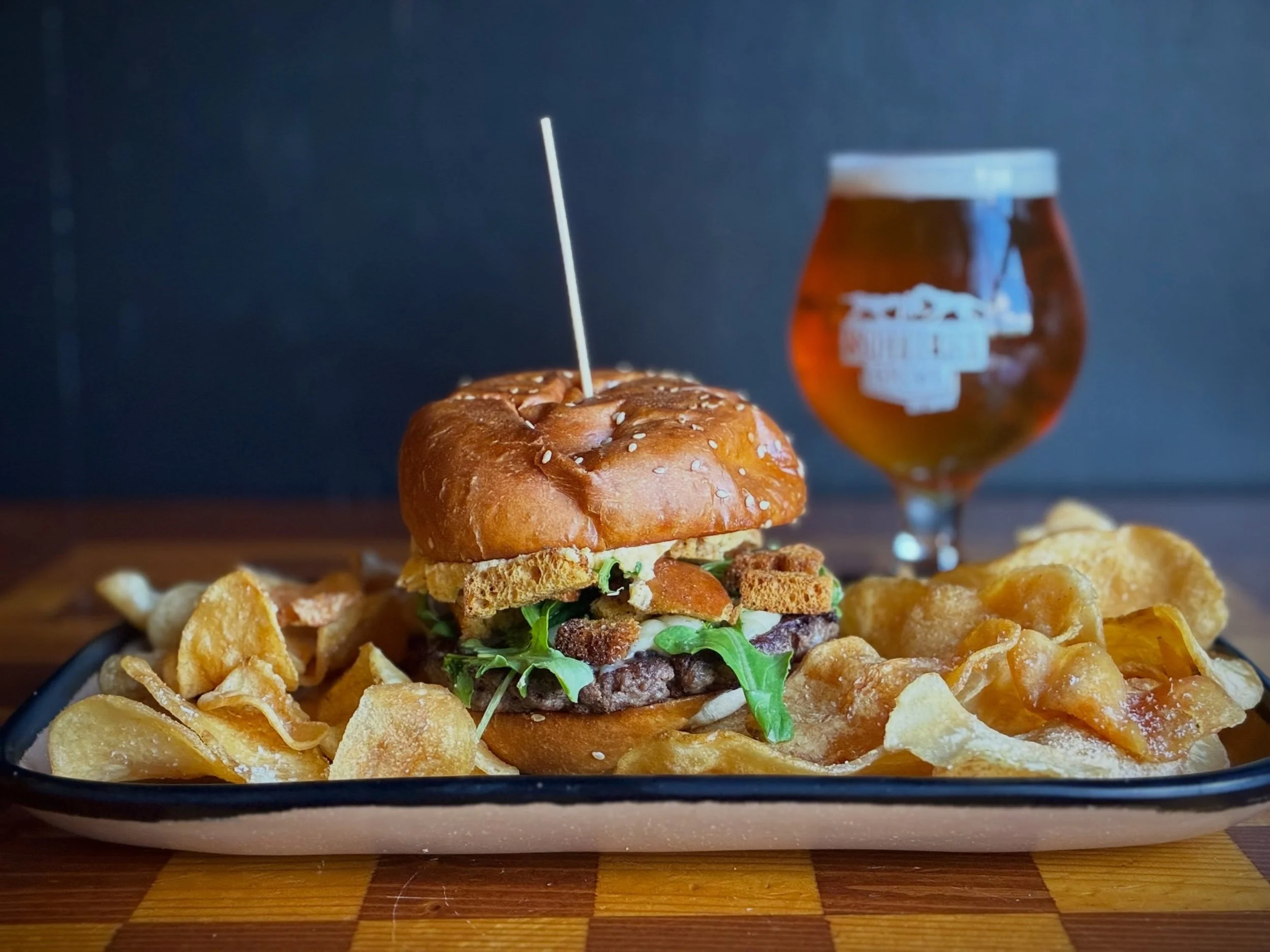 THE GREAT GOURDSBY BURGER topped with Asiago cheese, whipped butternut squash, stuffing-seasoned croutons, and arugula on a house sesame bun. 
Burger special available through Sunday during lunch, dinner, and brunch. 
Pair with HOWLER BOCK, available
