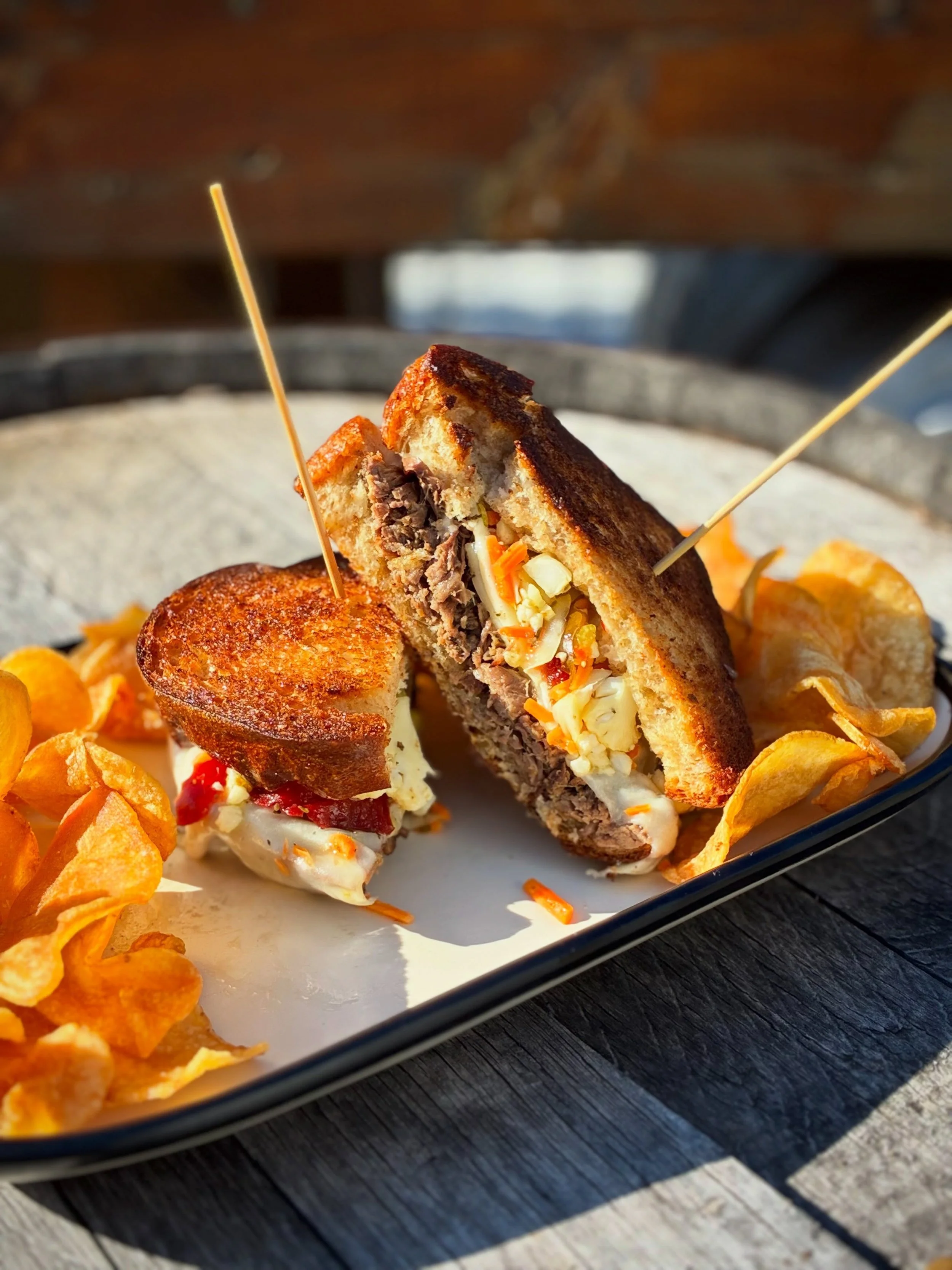 ITALIAN BEEF MELT, Italian shredded beef, giardiniera, white American cheese, and provolone cheese on house whole wheat bread. 
Available during dinner. 
Pair with PURR PILS, available on draft and in 16oz cans to-go. 
Full food and drink menus avail