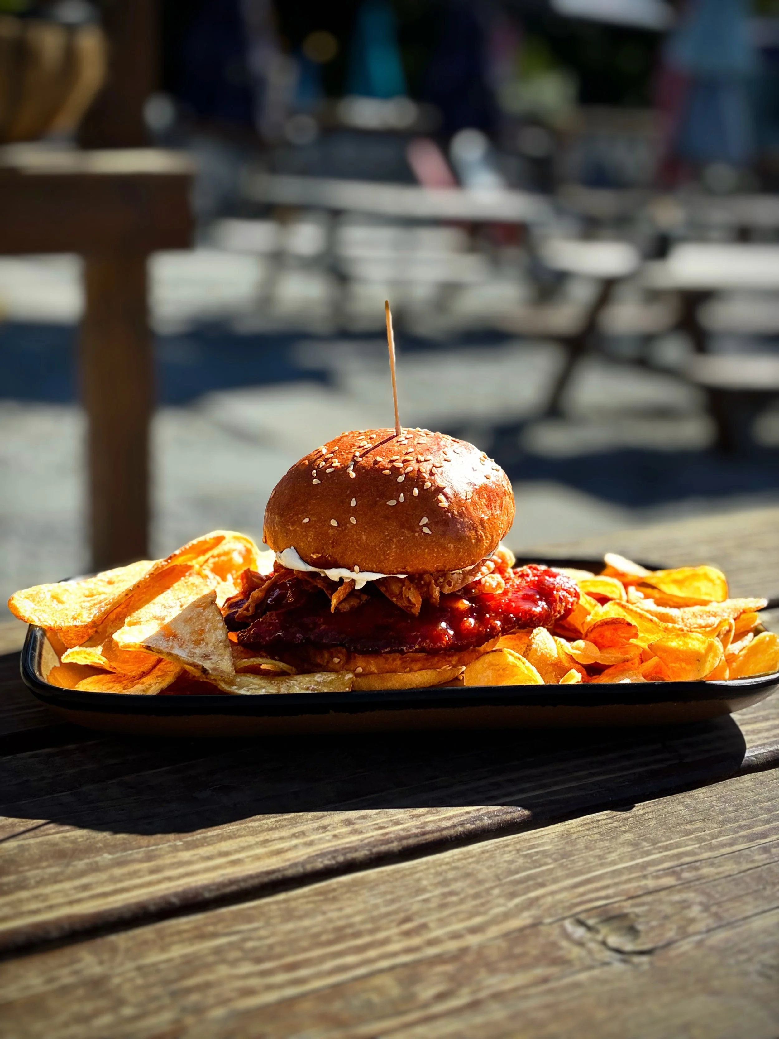 SWEET &amp; SOUR CHICKEN SANDWICH 
Panko crusted chicken breast topped with citrus sweet and sour sauce, green onion cream cheese spread, wonton strips, and Thai basil on a house sesame bun. 
Available during lunch, dinner, and brunch.
Pair with TIKI