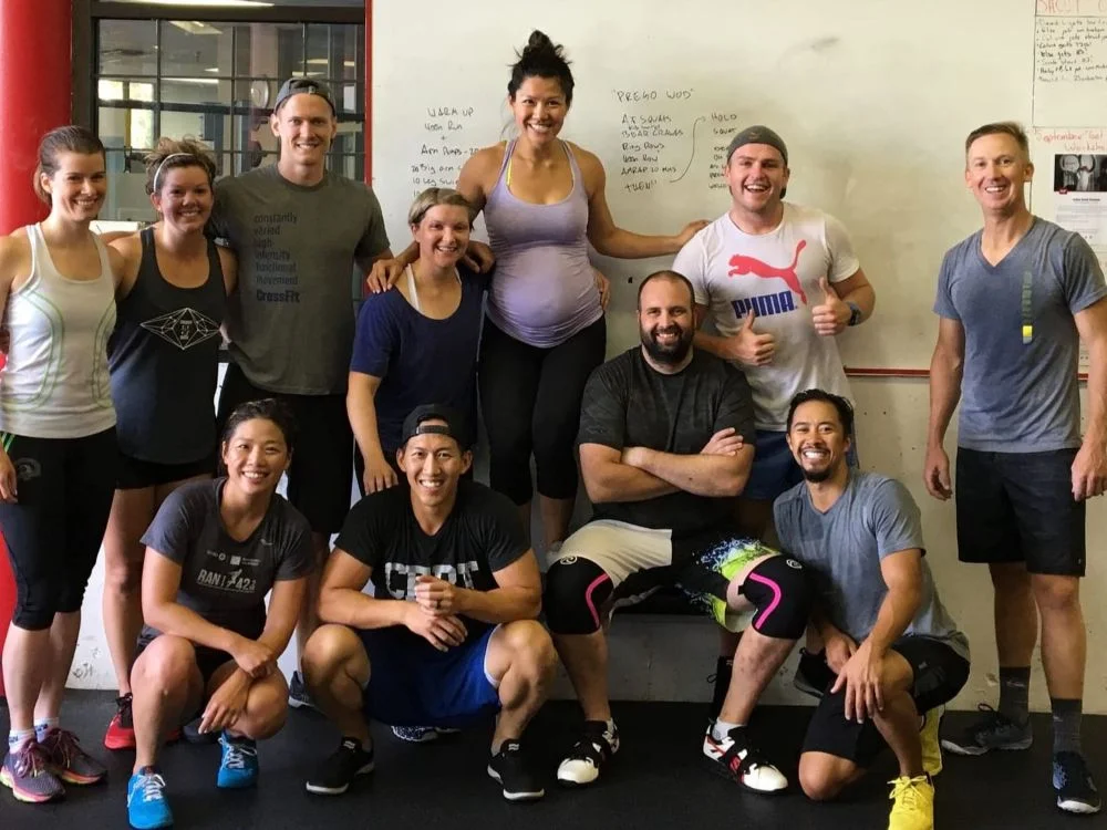 Anne and Jason dropping in at their old stomping grounds, CrossFit Westside in Vancouver, while Anne was 7 months pregnant. Work out of the day was named "Prego WOD"