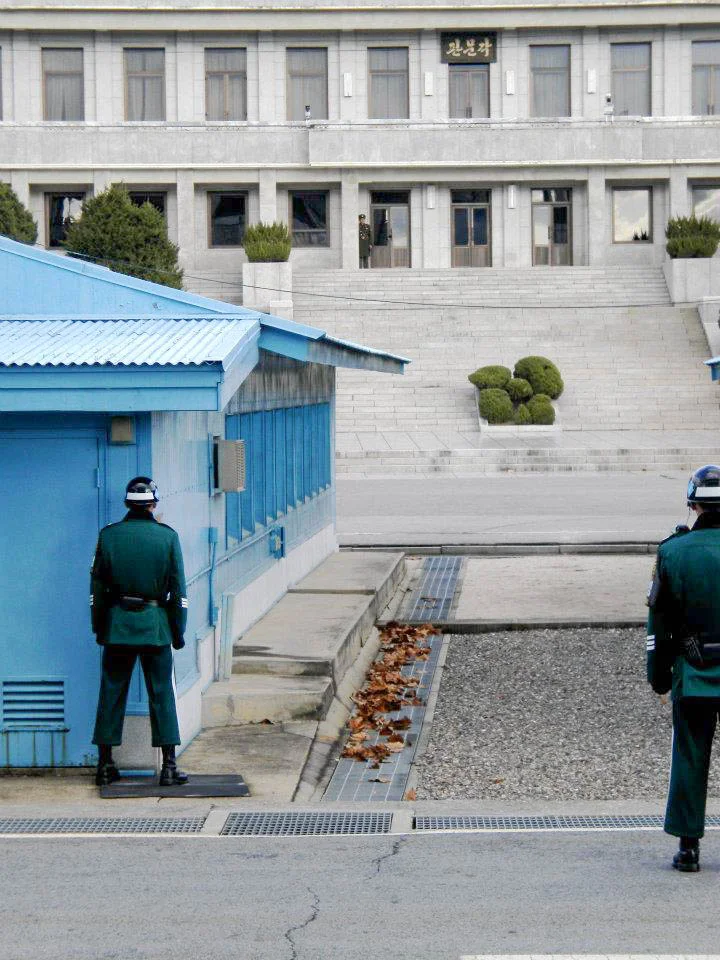 The line of demarcation is that cement line you see on the ground in the middle. We were told we were being video taped by NK. The SK soldiers were not allowed to move from this “neutral” stance for their entire shift.
