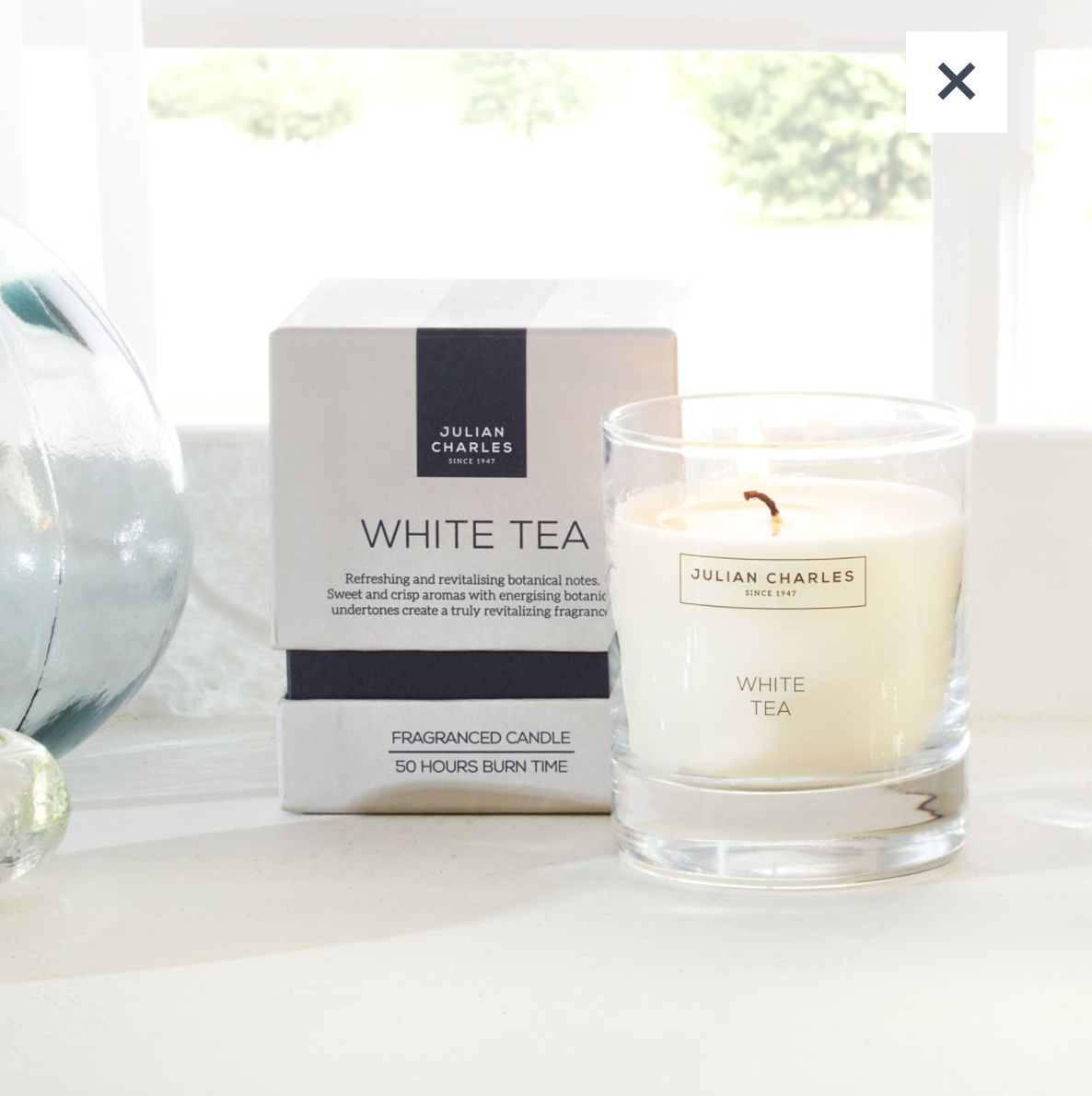 White tea candle , £10, Julian Charles