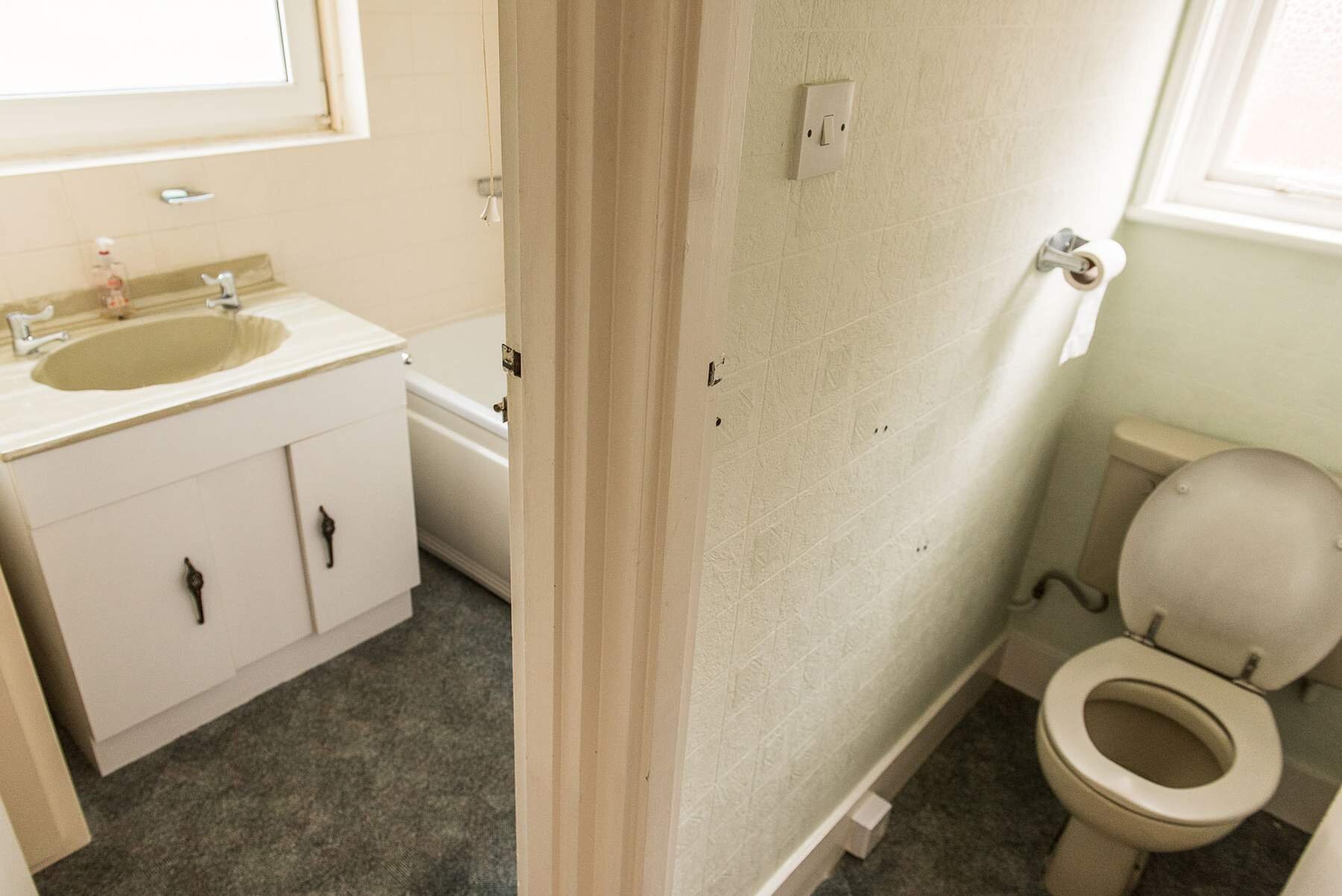 Before bathroom layout: the bathroom split by a dividing wall