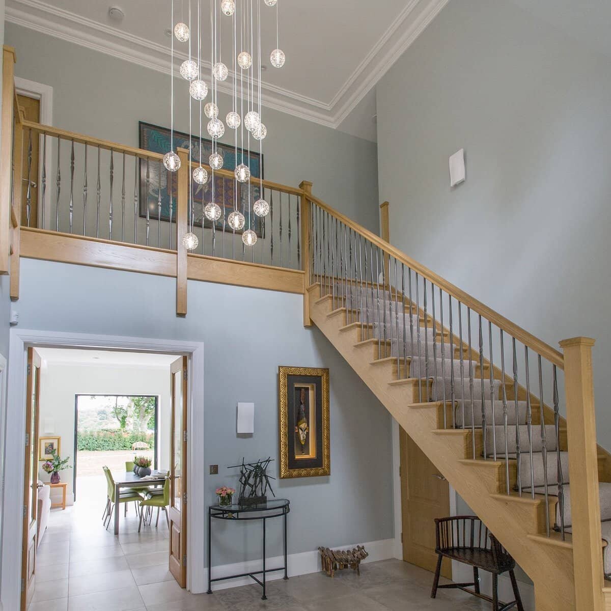 Pendant staircase lighitng - Image: Tricia Carroll Designs