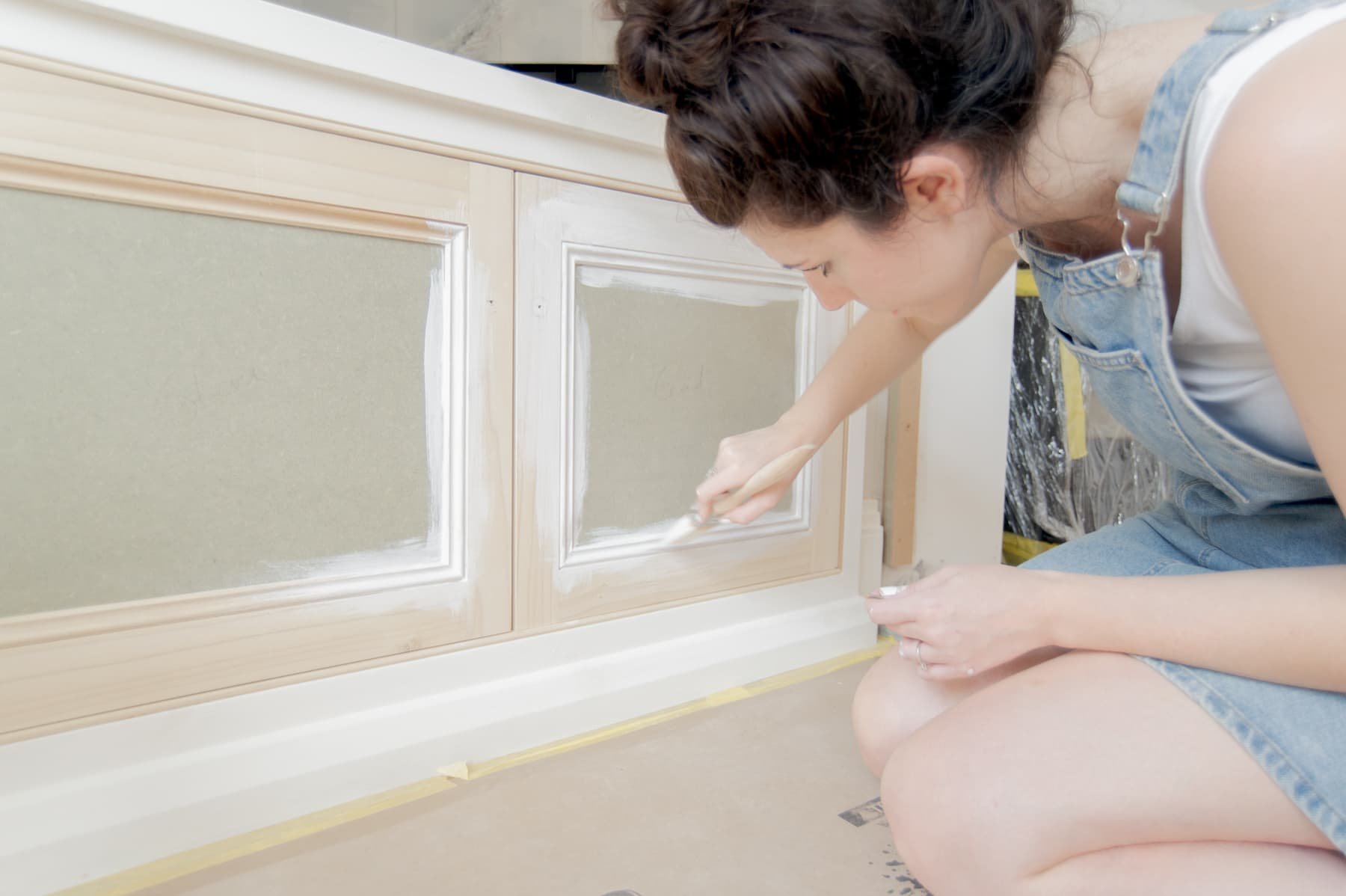 Lady painting woodwork