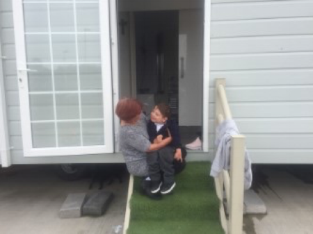 One of our Family Support Workers assisting Danny, a child with Cerebral Palsy, and his family to enable them to access support services