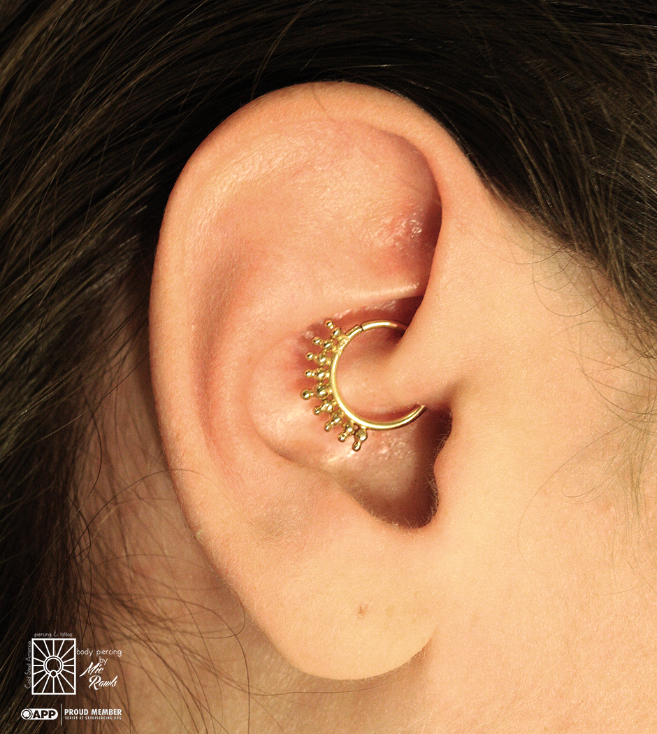 Fresh daith piercing from the other day. We think this solid Yellow Gold “Cora” ring from Buddha Jewelry Organics was such a great choice!