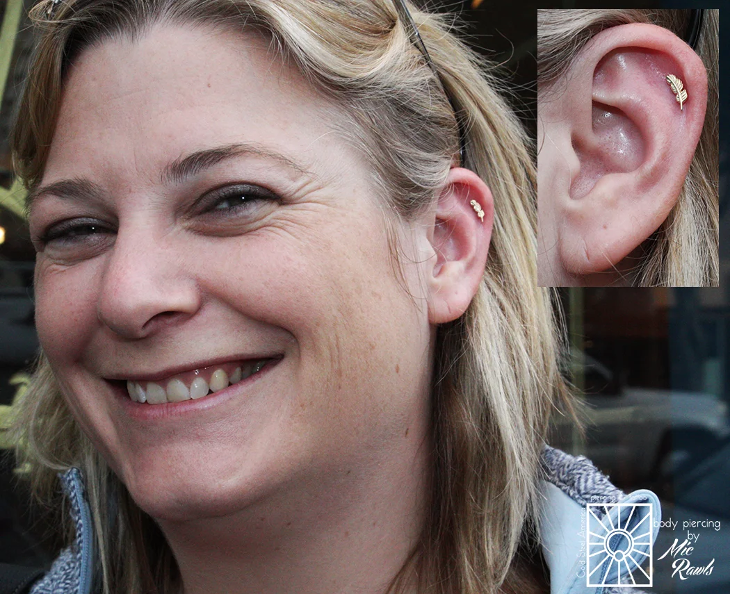 Mic did this helix piercing on this lovely lady two years ago, and she recently came back to fancy it up with one of those super cute solid yellow gold feather threadless ends from Body Vision Los Angeles!