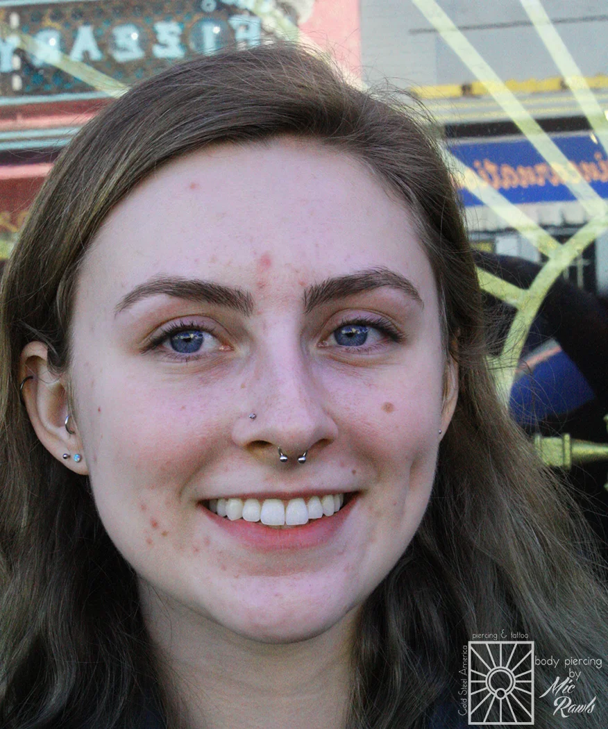 Fresh septum piercing wearing a 16g (1.2mm) implant-grade steel circular barbell from Industrial Strength.