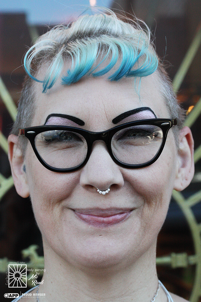 This absolutely fantastic lady came in to upgrade her healed septum piercing to one of those super cute n' shiny titanium gemmed clickers from Industrial Strength. Such a great choice!