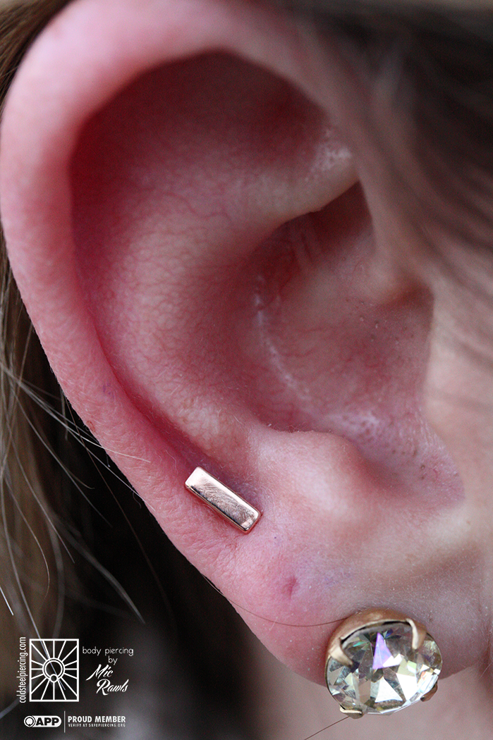 Fresh earlobe piercing wearing a super cute solid Rose Gold rectangle end from Body Gems! These little beauties have been pretty popular with our clients lately, and we love it!