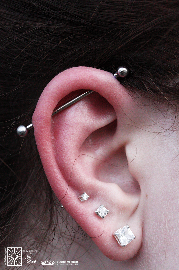 Fresh industrial piercing keeping it simple with an implant-grade steel barbell from Industrial Strength.