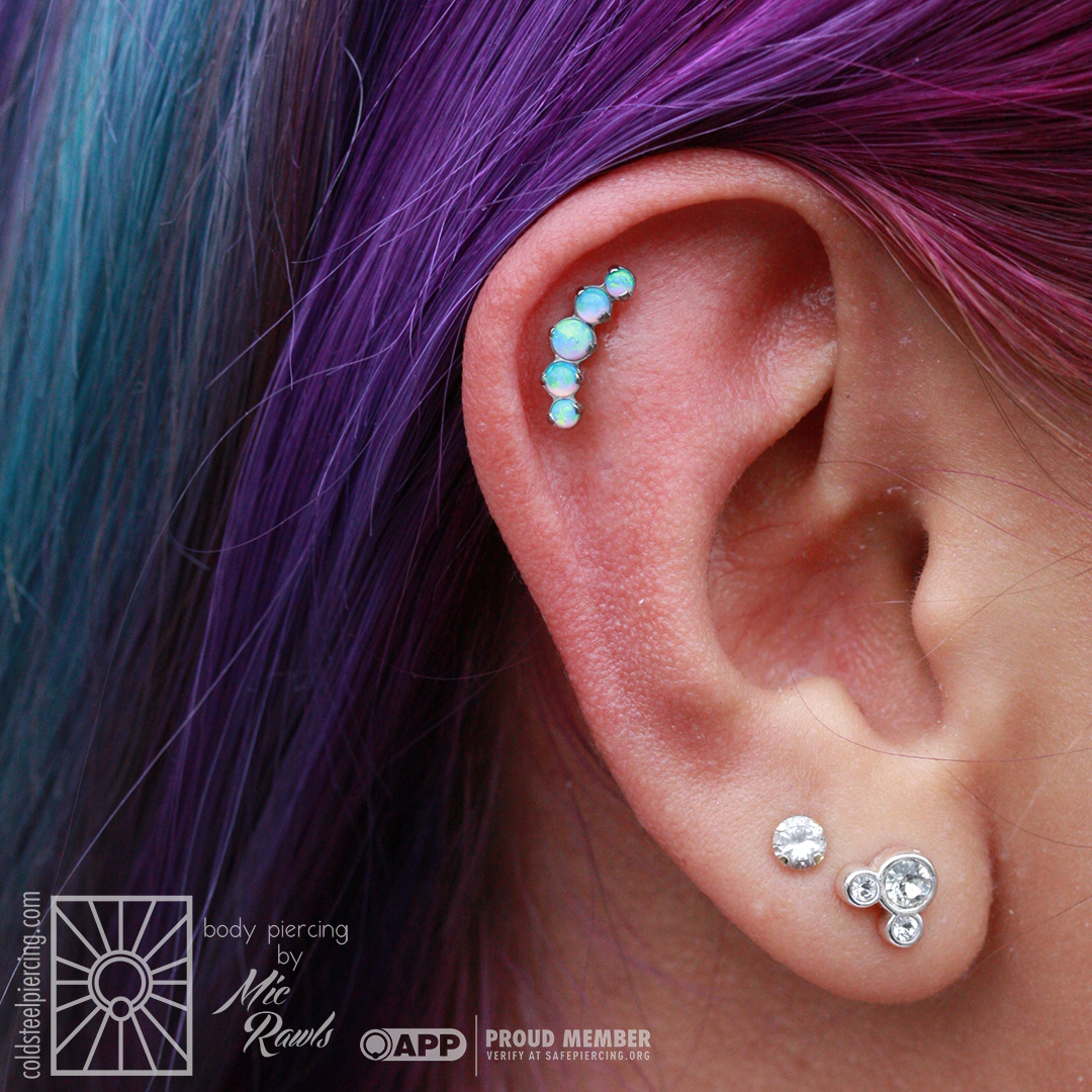 How PERFECTLY does this opal cluster go with her hair?! Cute new helix piercing for our cute client, done by Mic with jewelry from Industrial Strength.