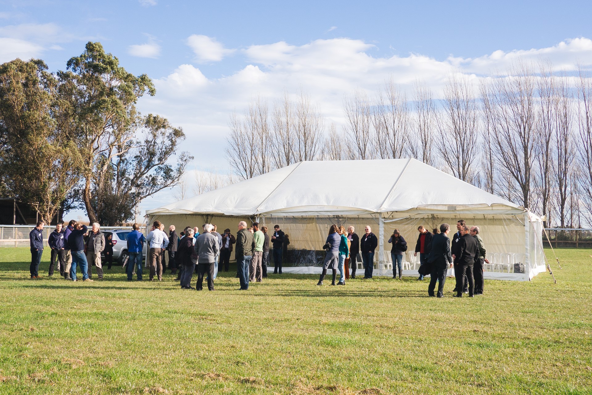 Attendees arrive at the enclosure.