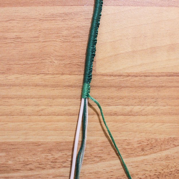 Change colors, allowing the remaining strand from your first color to blend in with the rest.