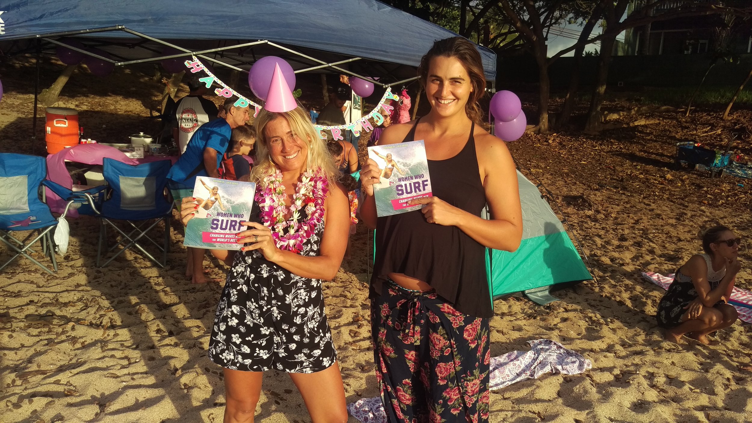 WOMEN WHO SURF - MERCEDES AND WRENNA WITH BOOKS