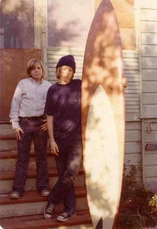 Moi with my beloved seven-foot Haut and my beloved Hang 10 shirt with my beloved brother Michael on the steps of our beloved house on Plum and Owen in the Seabright area of Santa Cruz. (Beloved bad wetsuit not shown)Photo: Mom.