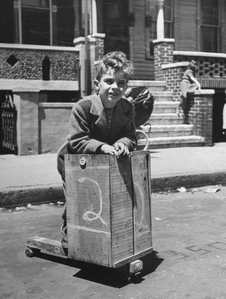 Scooter dude, ancestor of the modern skater dude. Look at the chick behind him, evading her eyes from All That Cool.