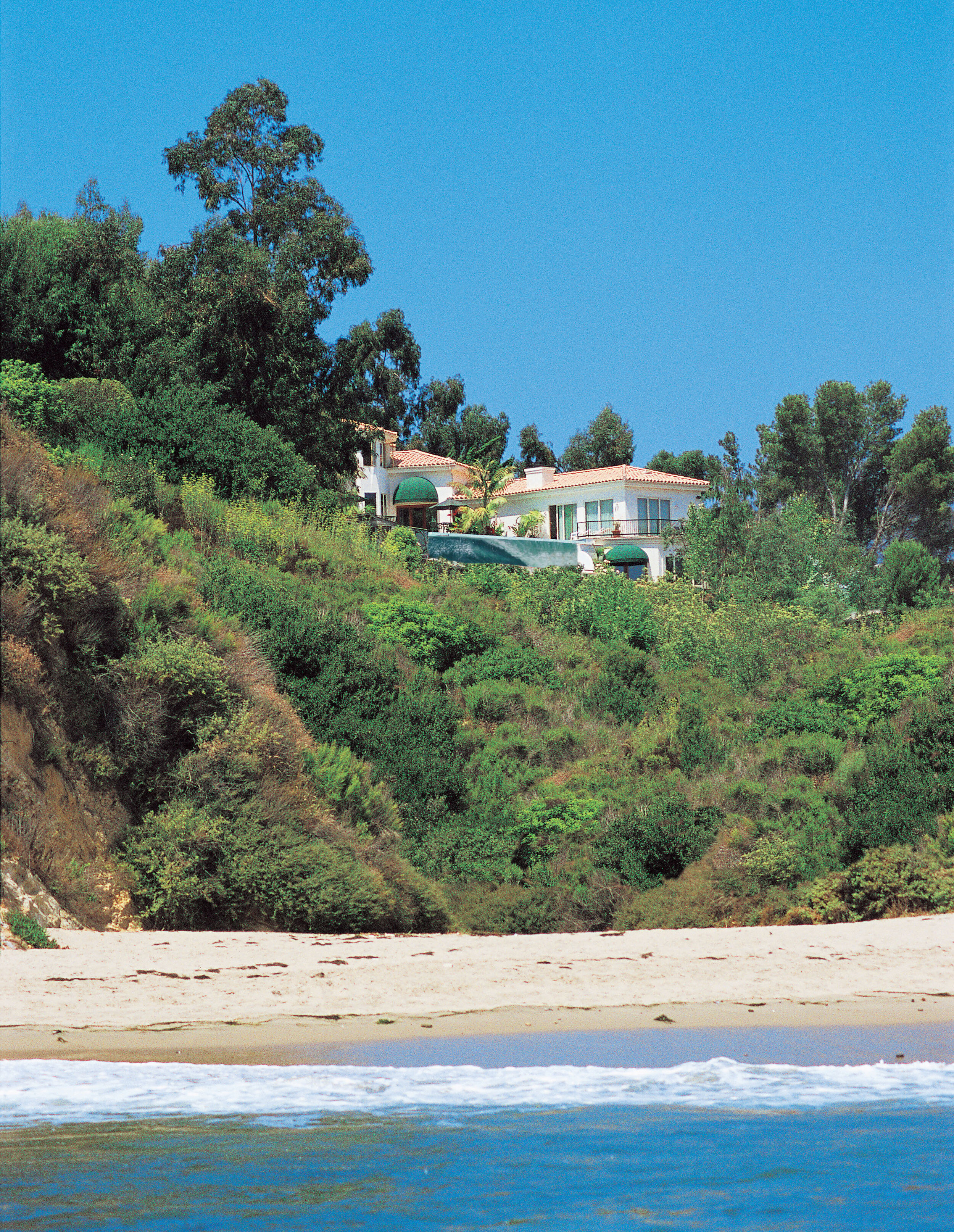  Griff’s castle, overlooking Paradise Cove and the Gulley and the deep blue sea. Ten thousand square feet, 13 bathrooms, rented for six figures to Russian oligarchs and Mexican beer heiresses.  