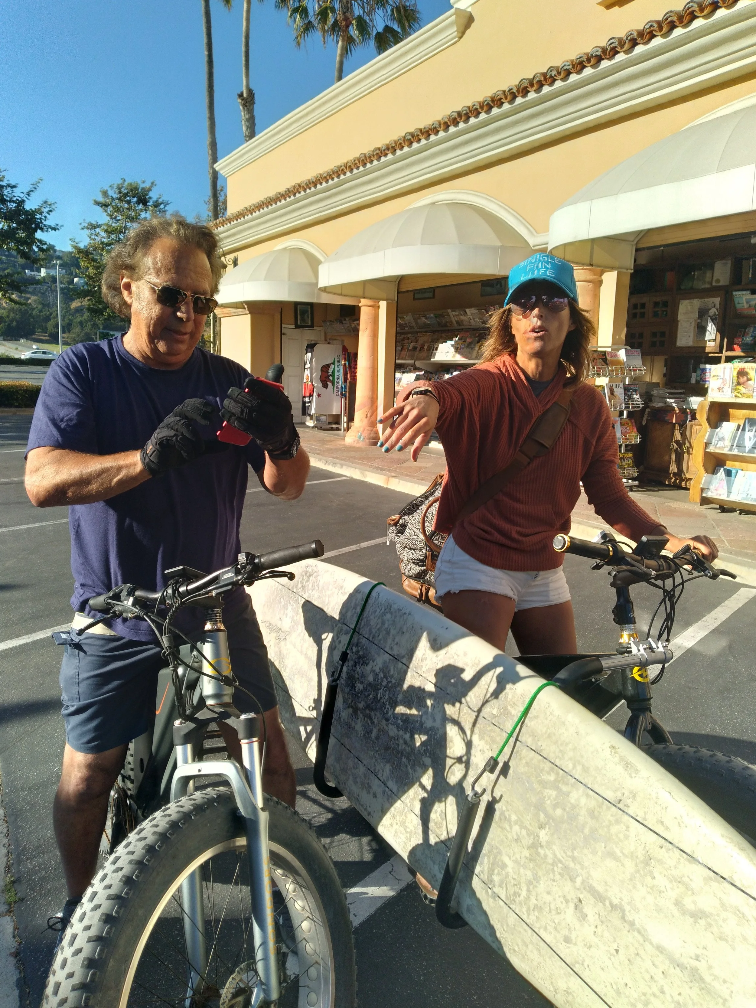 Kiki and John - on bikes newsstand - 20220709_181351.jpg