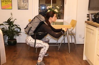 Squat with bag for extra weight