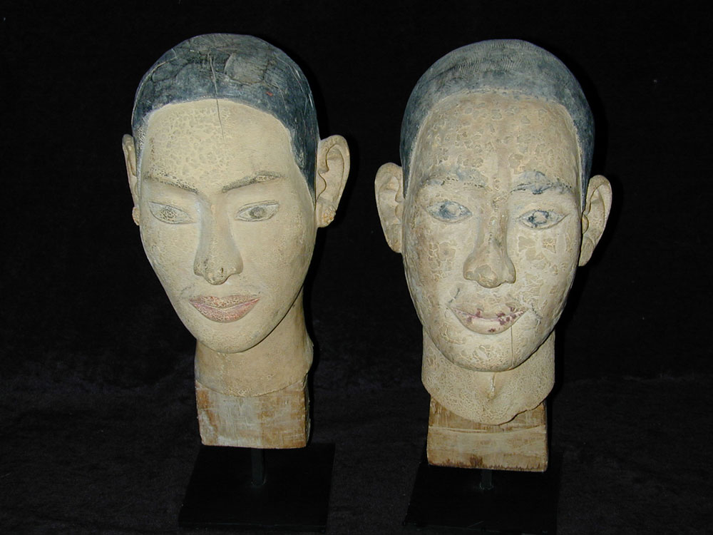 Sculpted polychromed wood heads of Mogallana and Sariputta, Burma, 18th/19th century.