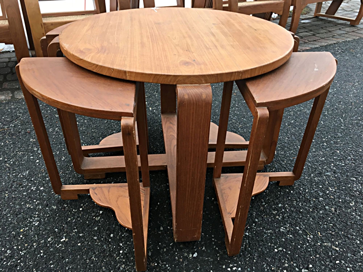 Teak wood table with four nesting side tables or stools, Siam, circa 1930s.