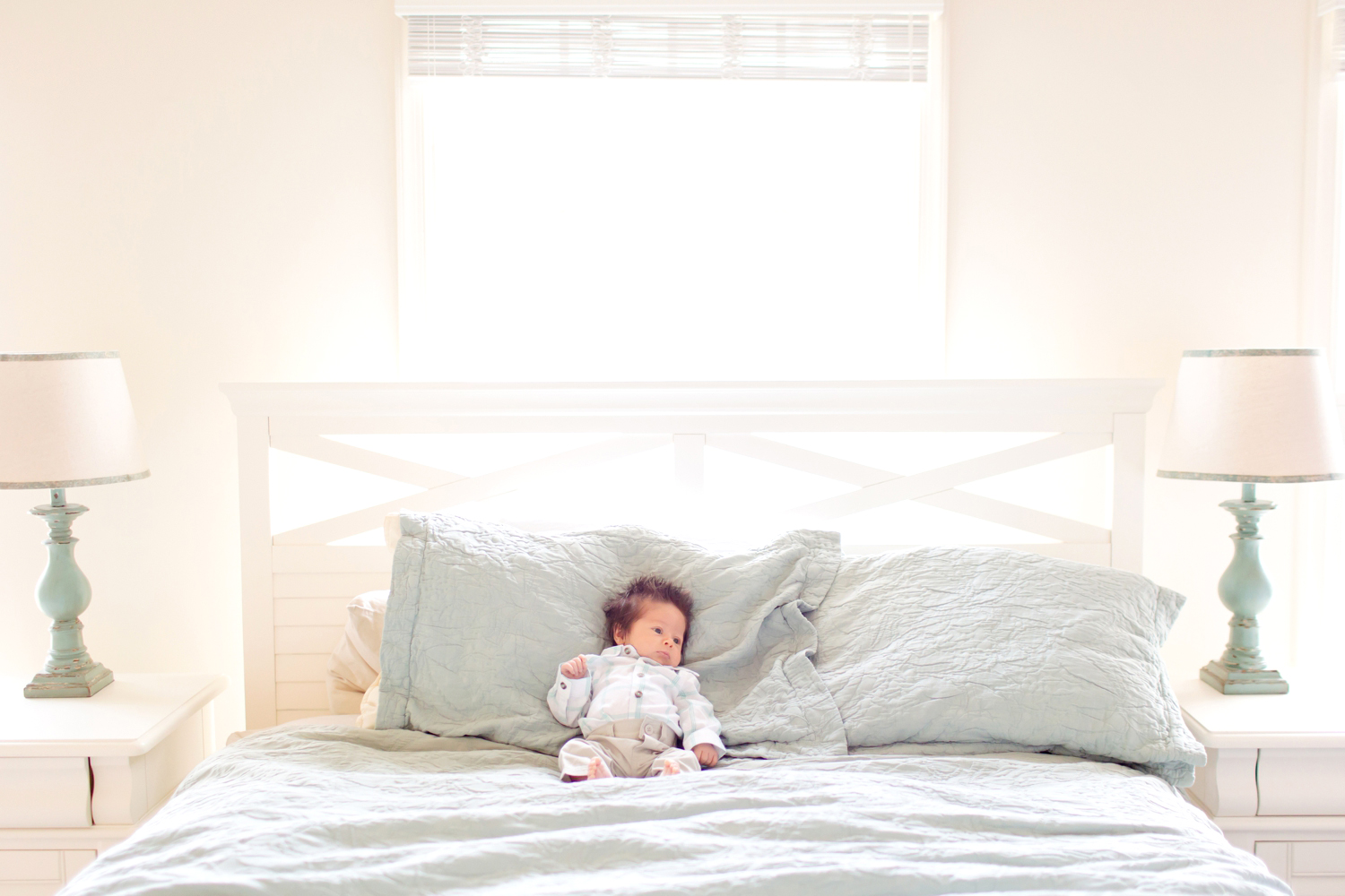  Such a small baby on a big bed! 