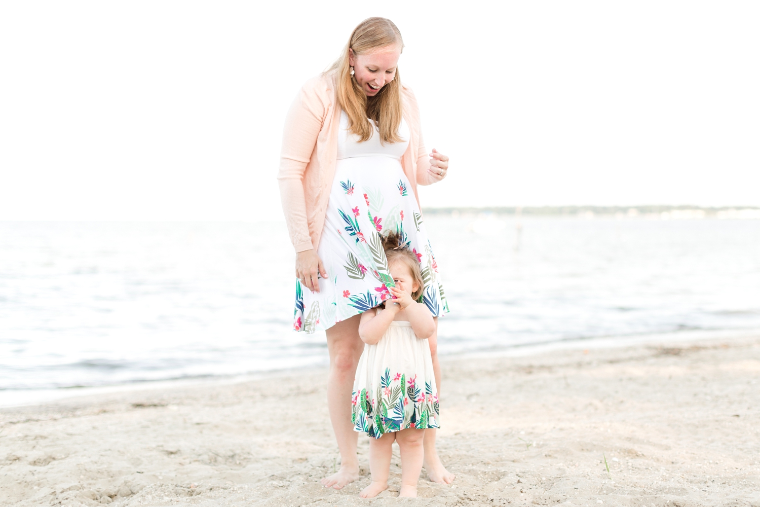  Playing hide-and-seek behind mommy’s dress. So cute! 