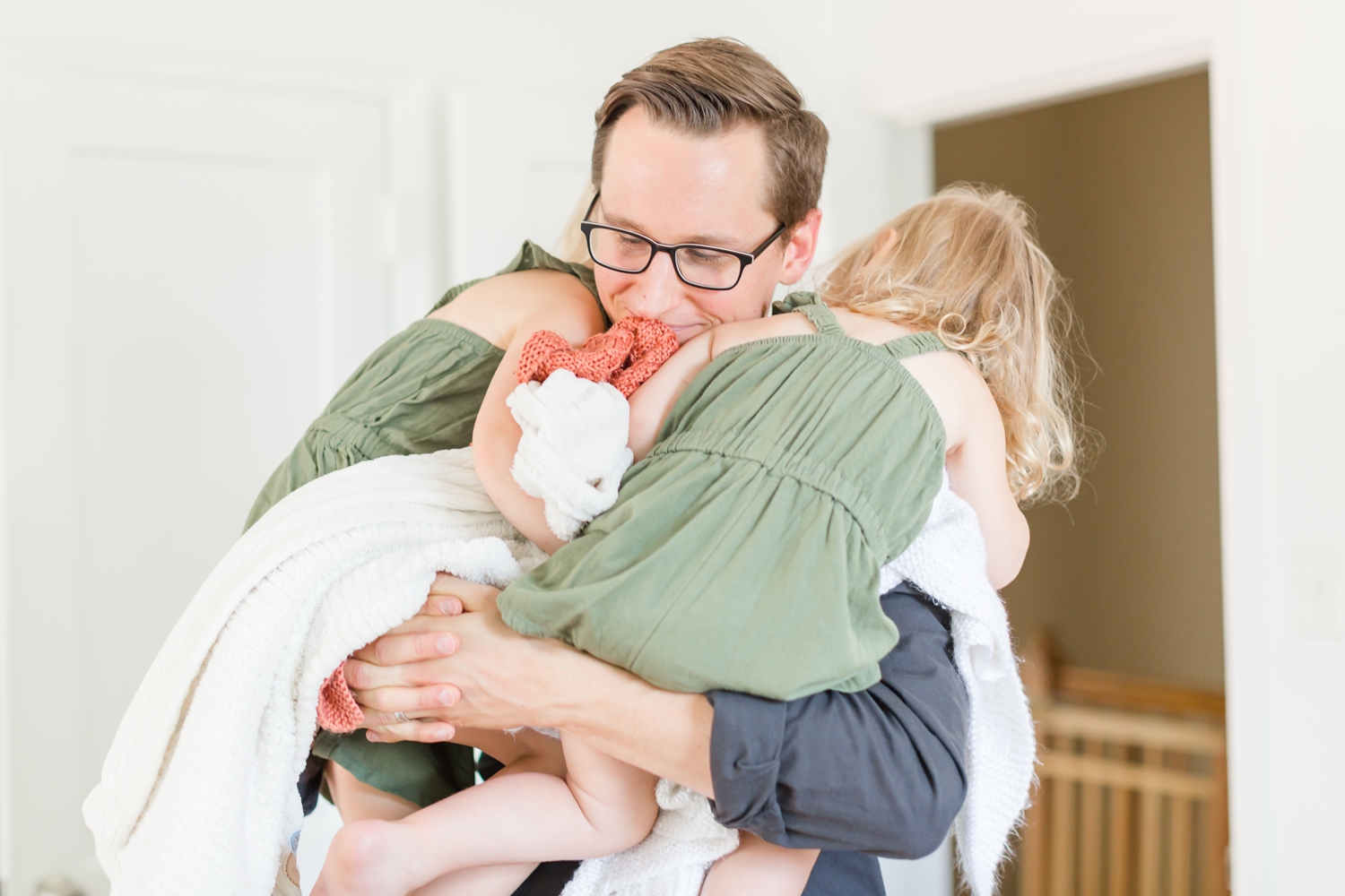  While I was taking pictures of Kristy with Levi, the girls just wanted to be held by Dad. So sweet. 