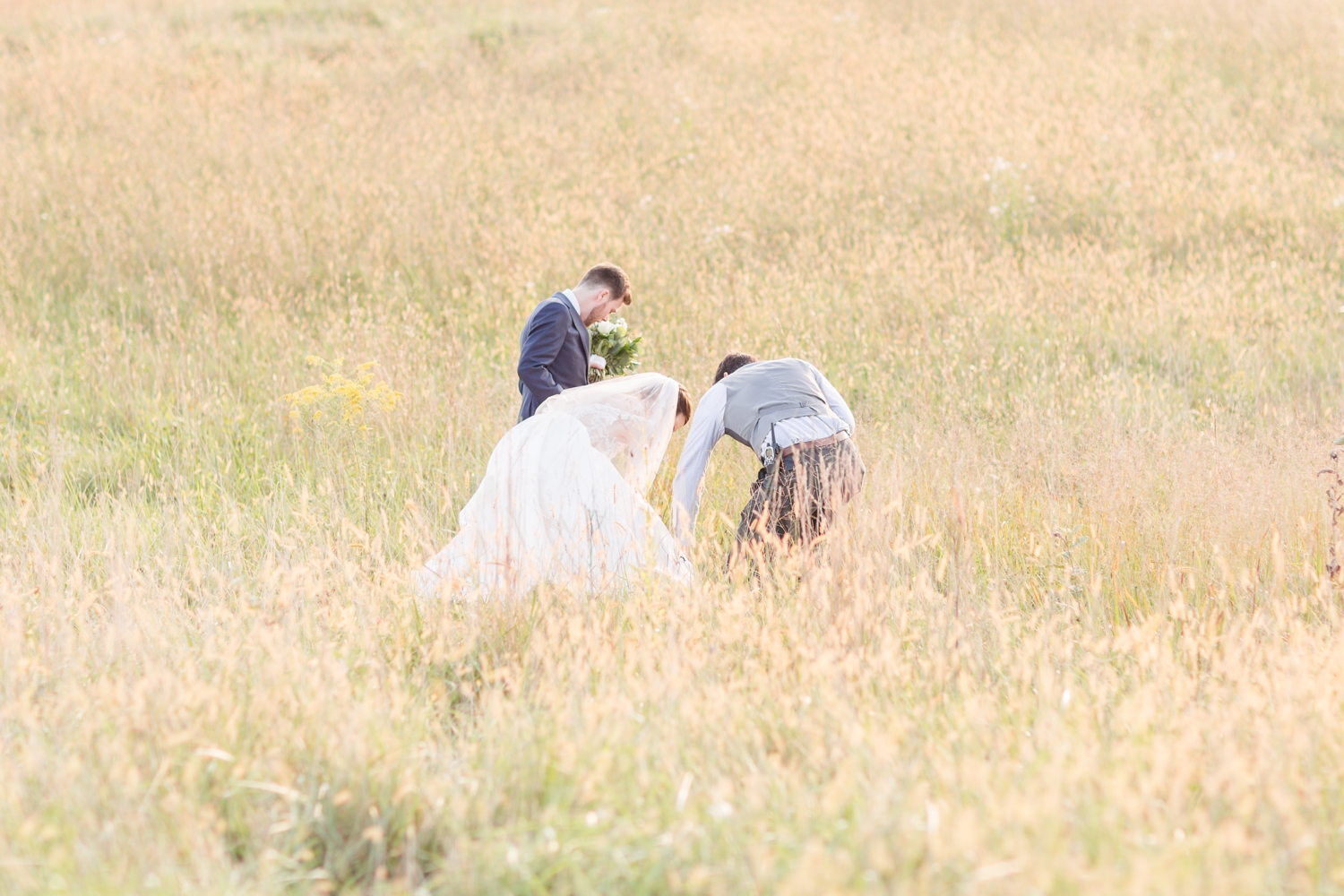  Kevin helping to make sure Kristen’s dress didn’t get caught in the field! 