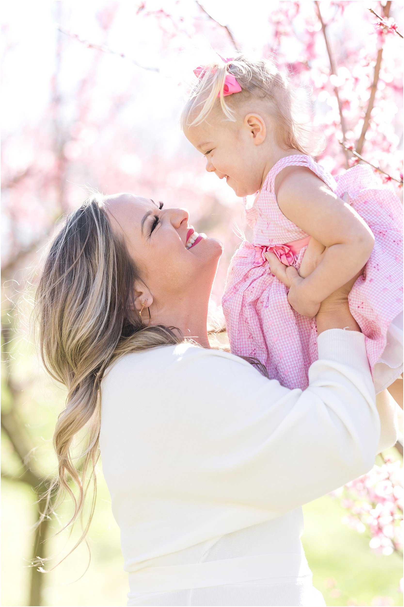 Hewetson Family 2023-17_Millstone-Orchard-peach-blossoms-Raleigh-family-photographer.jpg