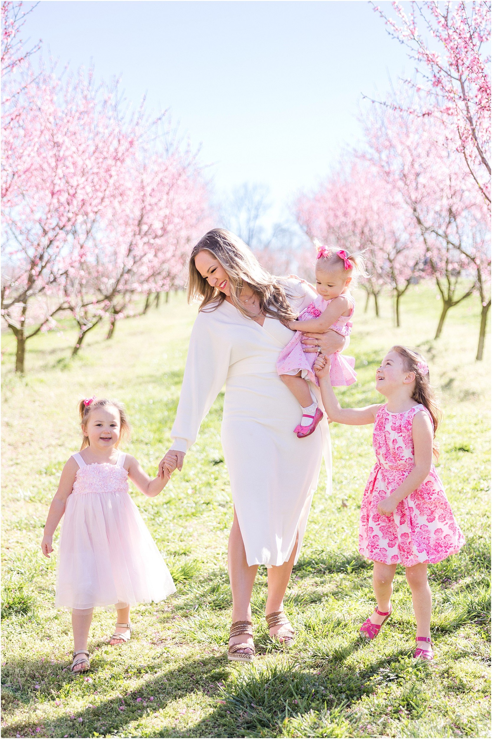 Hewetson Family 2023-54_Millstone-Orchard-peach-blossoms-Raleigh-family-photographer.jpg