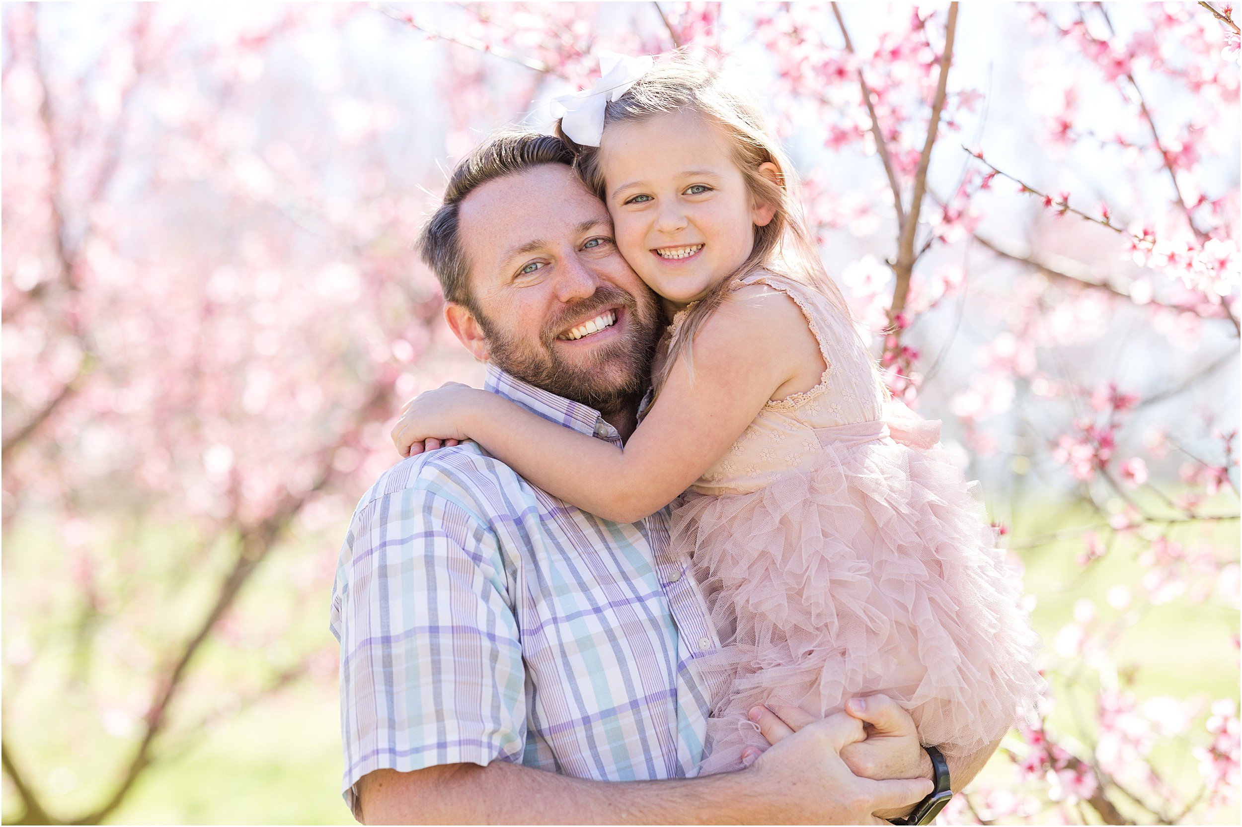 Wunderink Family Spring 2023-38_Millstone-Orchard-peach-blossoms-Raleigh-family-photographer.jpg