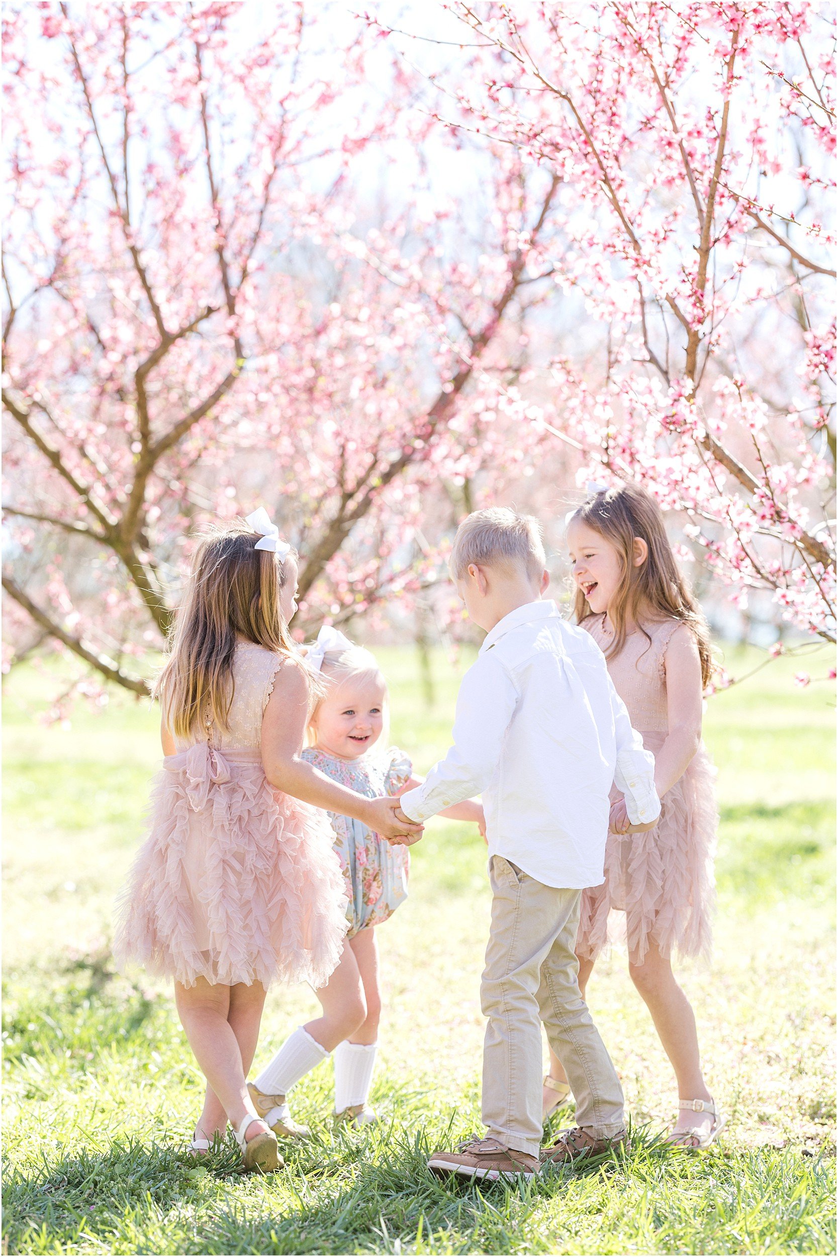 Wunderink Family Spring 2023-53_Millstone-Orchard-peach-blossoms-Raleigh-family-photographer.jpg